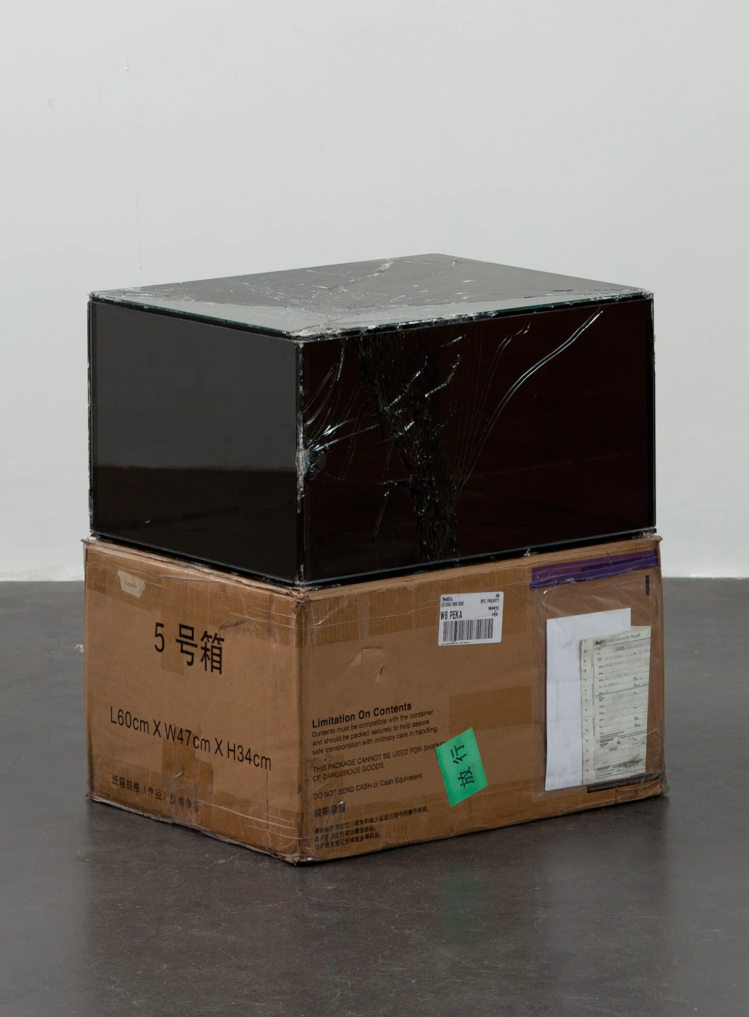 FedEx® Large Kraft Box © 2004 FEDEX 155143 REV 10/04 SSCC, International Priority, Los Angeles–Beijing trk#858510689297, September 9–22, 2011, International Priority, Beijing–Los Angeles trk#874594463990, March 13–14, 2012, Standard Overnight, Los Angeles–New Castle trk#800105416382, July 24–31, 2012, Express Saver, New Castle–Los Angeles trk#492446927223, July 26–31, 2012, Standard Overnight, Los Angeles–New Castle trk#800983717990, April 10–11, 2013 2011– Laminated Mirropane, FedEx shipping box, accrued FedEx shipping and tracking labels, silicone, metal, tape 14 1/2 x 23 5/8 x 18 1/2 x inches Securities and Exchanges, 2011