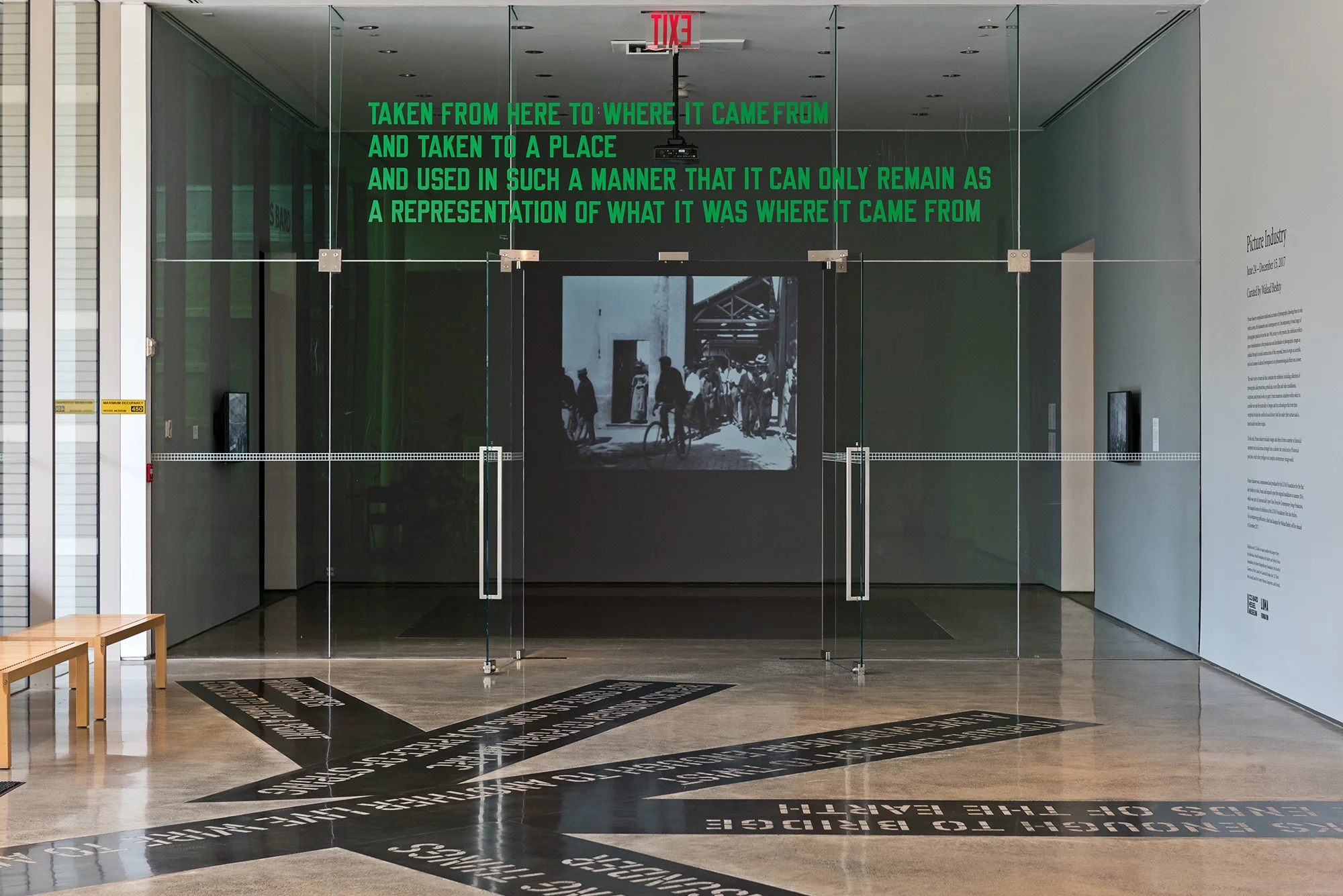 Picture Industry , Hessel Museum, Center for Curatorial Studies, Bard College, Annandale-on-Hudson, NY, 2017. Featuring the work of: Thom Andersen, David Askevold, Lewis Baltz, Georges Bataille, Bernd and Hilla Becher, Ericka Beckman, Gretchen Bender, Lynda Benglis, Alphonse Bertillon, Black Audio Film Collective, Black Star Productions (Stewart Bird, Peter Gessner, René Lichtman and John Louis, Jr. in association with the League of Revolutionary Black Workers), Barbara Bloom, Mel Bochner, Duchenne de Boulogne, Sarah Charlesworth, Charles Darwin, Ariel Dorfman and Armand Mattelart, Stan Douglas, William Emory, Walker Evans, Harun Farocki, Morgan Fisher, LaToya Ruby Frazier, Lee Friedlander and Stuart Klipper, Ernst Friedrich, Francis Galton, Isa Genzken, Octavio Getino and Fernando Solanas, Frank Gilbreth, Liz Glynn, Jack Goldstein, Dan Graham, Johan Grimonprez, James Hague et al., Lyle Ashton Harris, John Heartfield, Lewis Hine, Thomas Hirschhorn, Yngve Holen, Jenny Holzer, William Henry Jackson, Arthur Jafa, Fritz Kahn, Stephen Kaltenbach, Louise Lawler, Sherrie Levine, Glenn Ligon, Sharon Lockhart, Louis Lumière, Robert Mapplethorpe, Étienne-Jules Marey, Kerry James Marshall, Renzo Martens, Allan McCollum, Boris Mikhailov, Mitchell & Kenyon, Charles Moore, Jean-Luc Moulène, Eadweard Muybridge, Timothy O'Sullivan, Paul Pfeiffer, Jack Pierson, Seth Price, Jacob Riis, Jeroen de Rijke and Willem de Rooij, Martha Rosler, Cameron Rowland, August Sander, Allan Sekula, Stephen Shore, Hito Steyerl, William Henry Fox Talbot, Georges Gilles de la Tourette, Wolfgang Tillmans, Sojourner Truth, Cosey Fanni Tutti, Kelley Walker, Jeff Wall, Lawrence Weiner, and Christopher Williams.