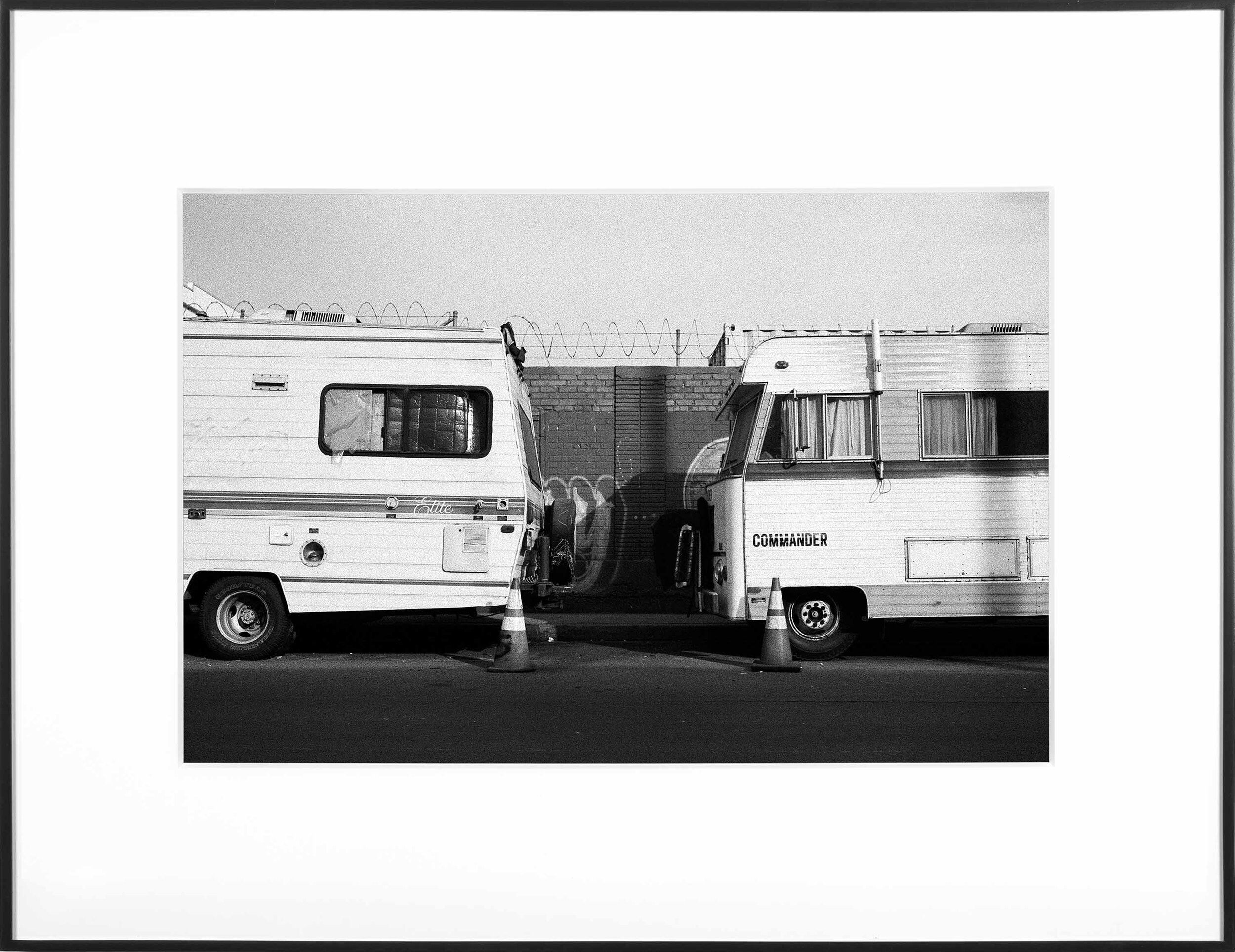   (Temporary) Homes for America: 3300 block to 4400 block, Union Pacific Avenue, between South Grande Vista Avenue and South Marianna Avenue, Los Angeles/Commerce, California, December 2020   2021  black and white fiber print 11 x 15 inches 