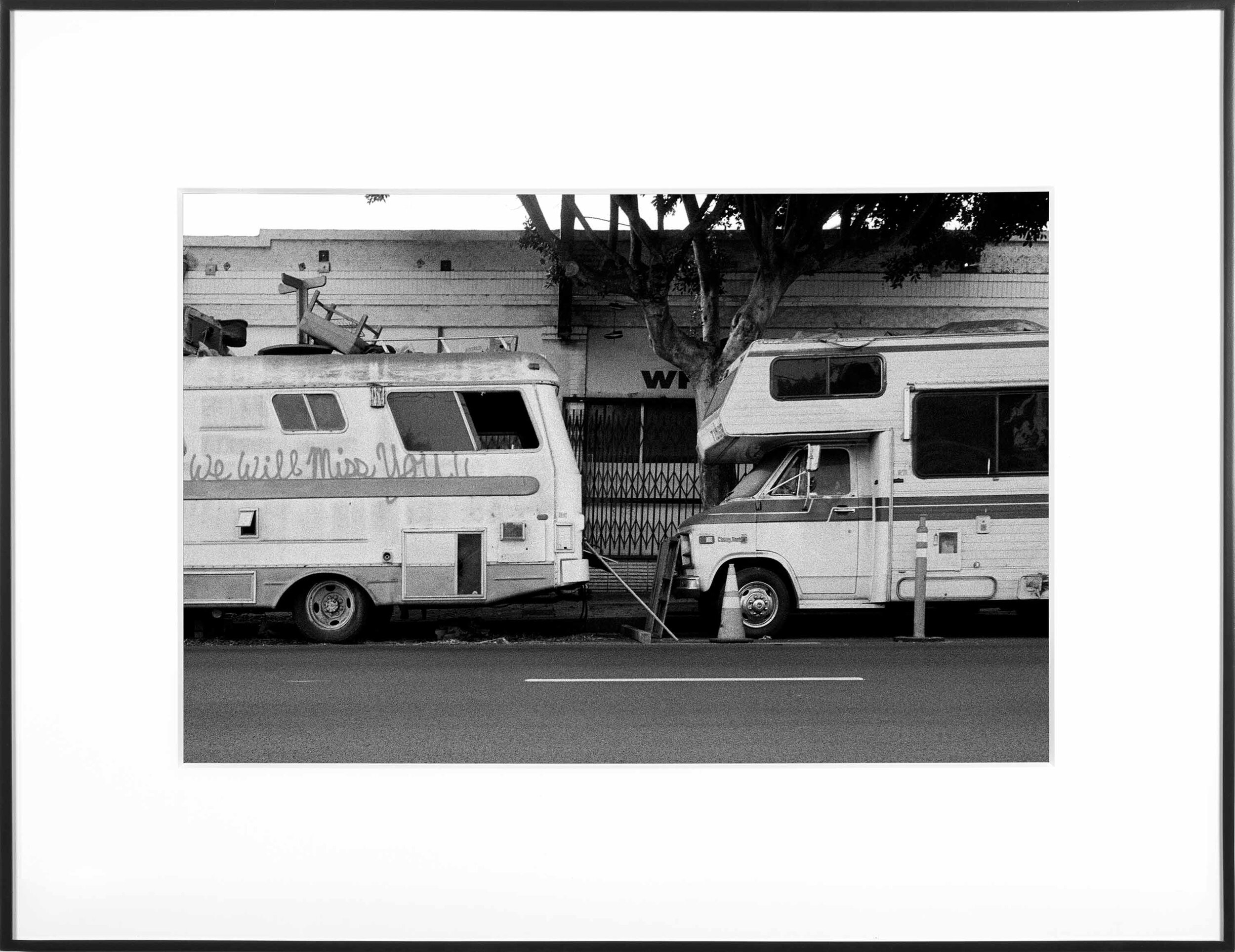   (Temporary) Homes for America: 3300 block to 4400 block, Union Pacific Avenue, between South Grande Vista Avenue and South Marianna Avenue, Los Angeles/Commerce, California, December 2020   2021  black and white fiber print 11 x 15 inches 