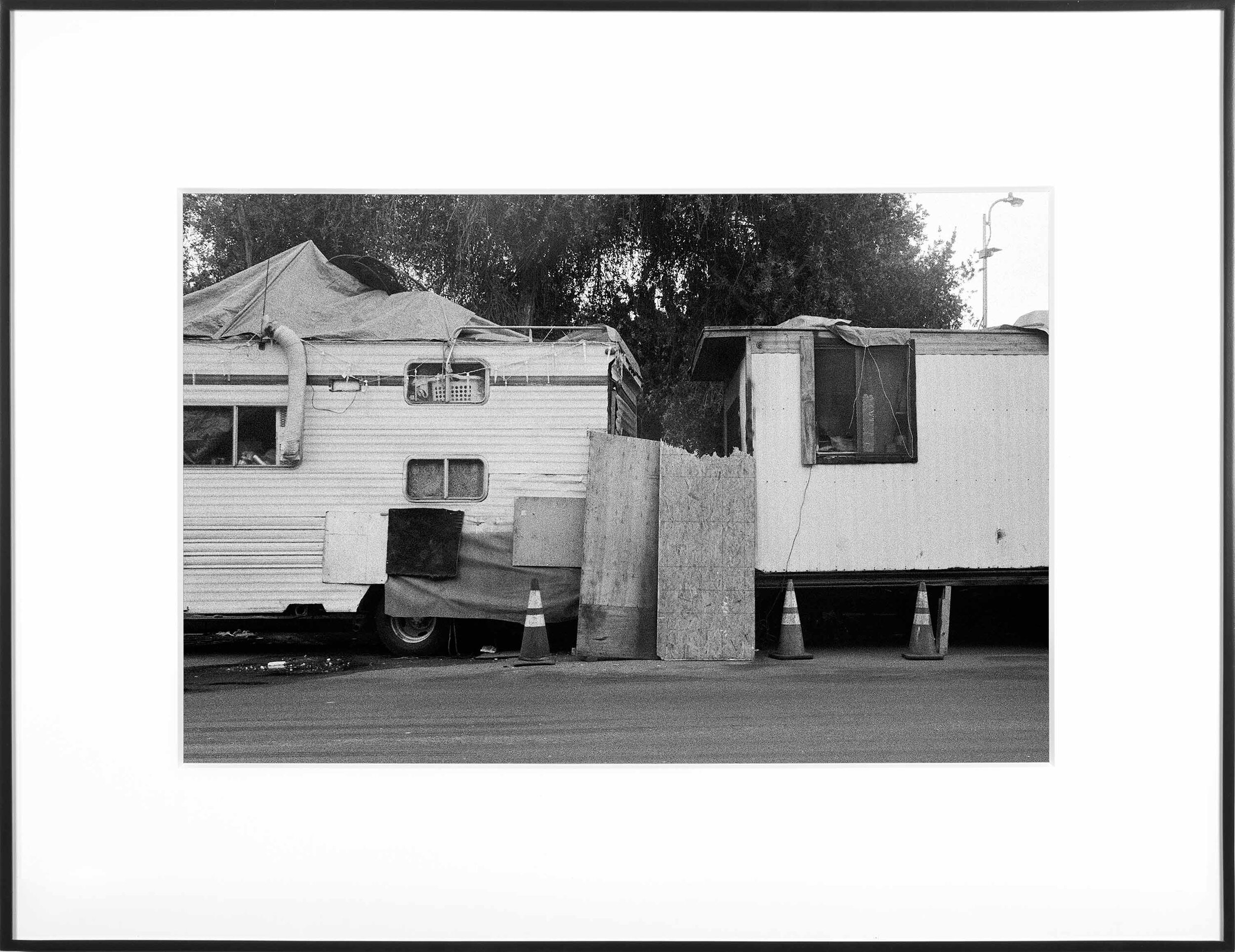   (Temporary) Homes for America: 3300 block to 4400 block, Union Pacific Avenue, between South Grande Vista Avenue and South Marianna Avenue, Los Angeles/Commerce, California, December 2020   2021  black and white fiber print 11 x 15 inches 