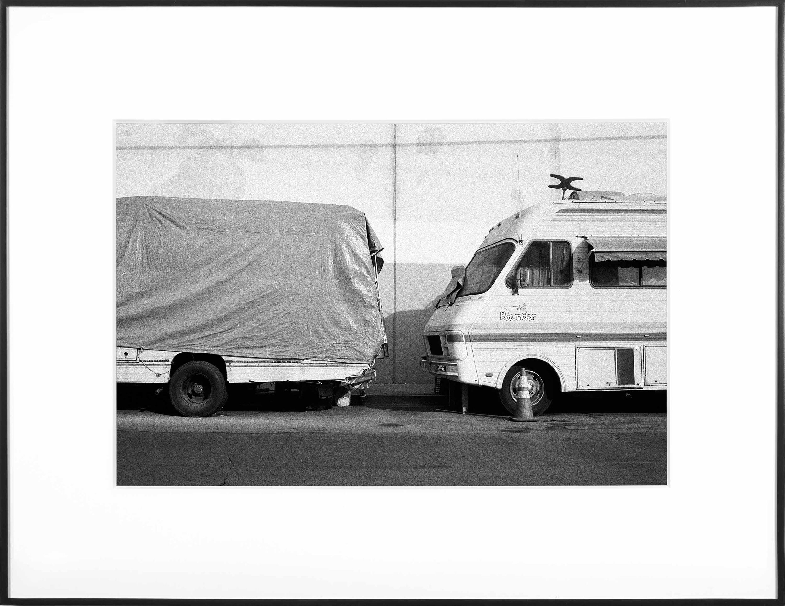   (Temporary) Homes for America: 3300 block to 4400 block, Union Pacific Avenue, between South Grande Vista Avenue and South Marianna Avenue, Los Angeles/Commerce, California, December 2020   2021  black and white fiber print  11 x 15 inches  Exhibit