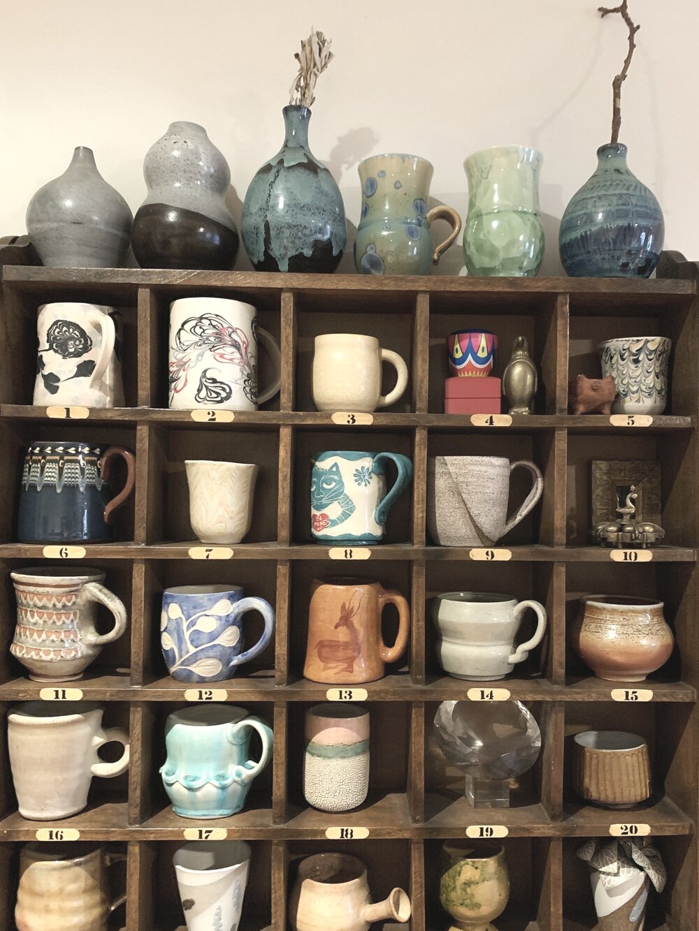  Morgan's mug collection including one of her earlier pieces 