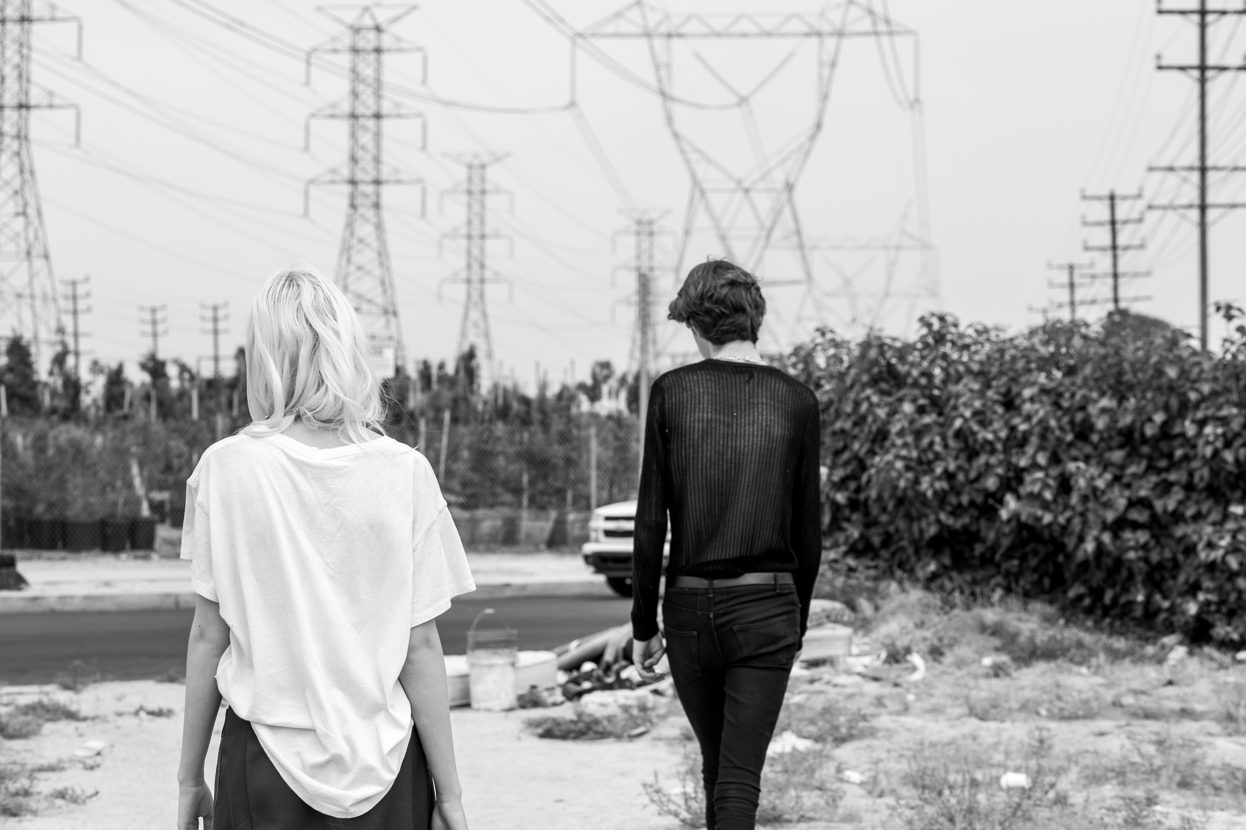 Jack wears a mesh top by The Kooples , jeans by Saint Laurent , belt vintage . Cynda wears a top by Madeworn from Kin Los Angeles , and a skirt by Phillip Lim from Kin Los Angeles.