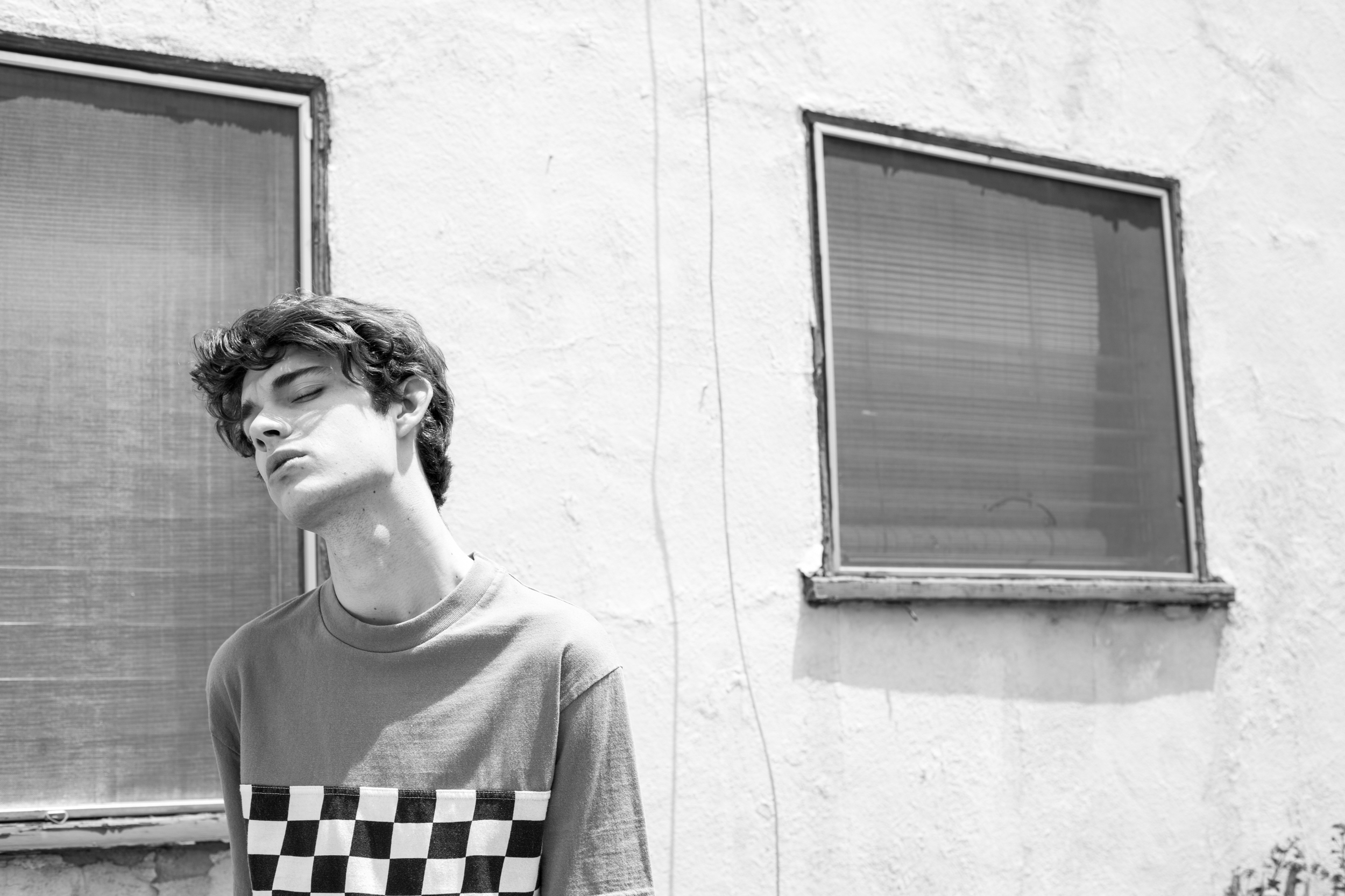 Jack wears checkered tee by CPO .