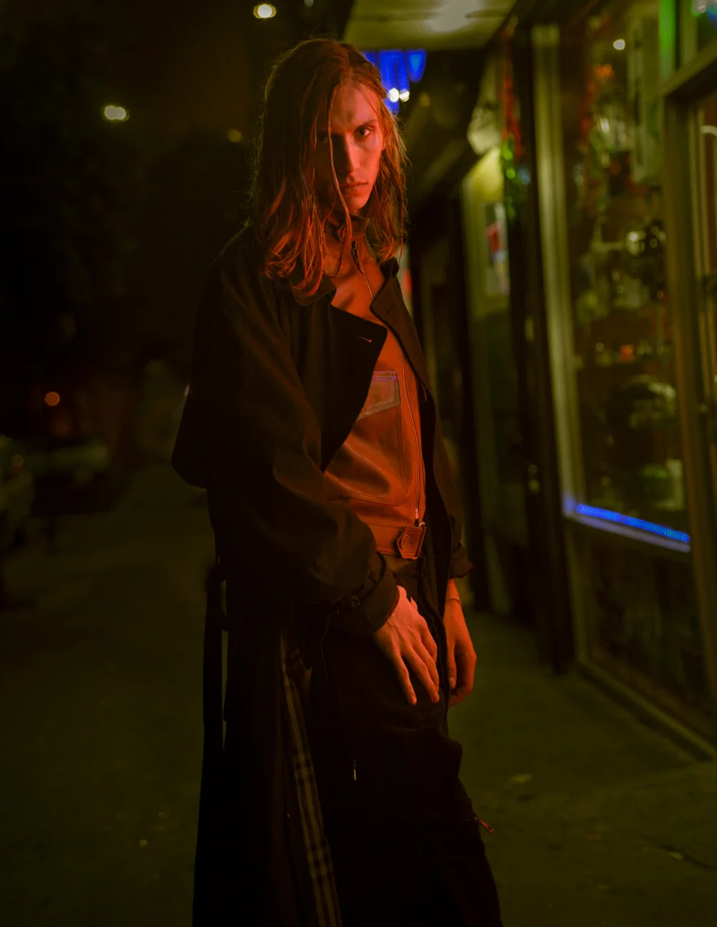 Andrew wears coat by Burberry , jacket by Bottega Veneta and pants by Lacoste .