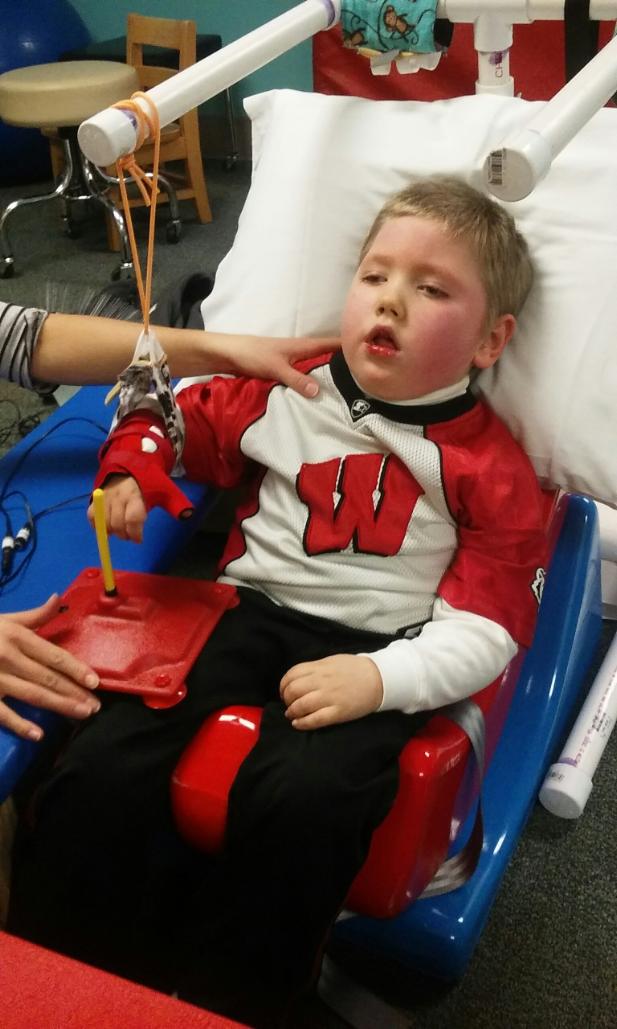 Caleb – a future Badger – working his switch in therapy. 