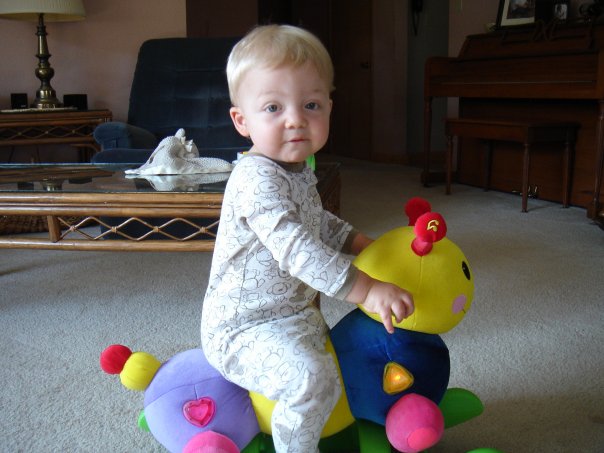  Owen as a toddler on his favorite catepillar 
