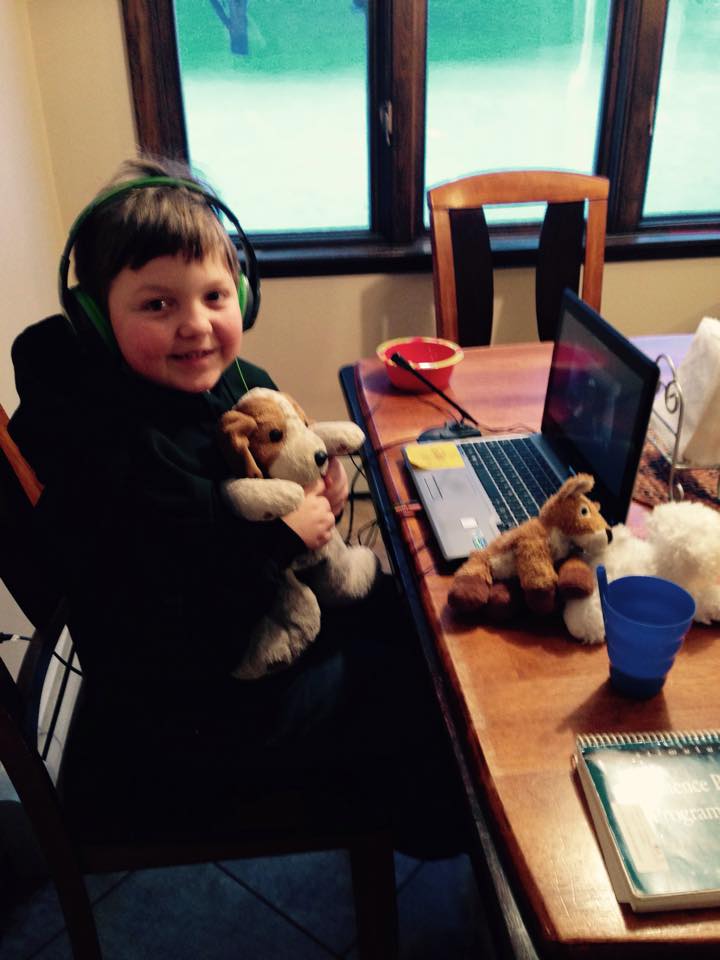 Owen participating in a teletherapy session to help with speech and language