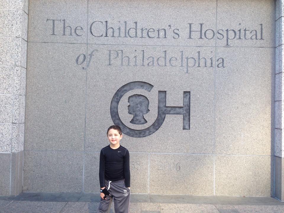  Chase triumphantly stands outside the Children’s Hospital of Philadelphia the day he was discharged after his initial stroke. 