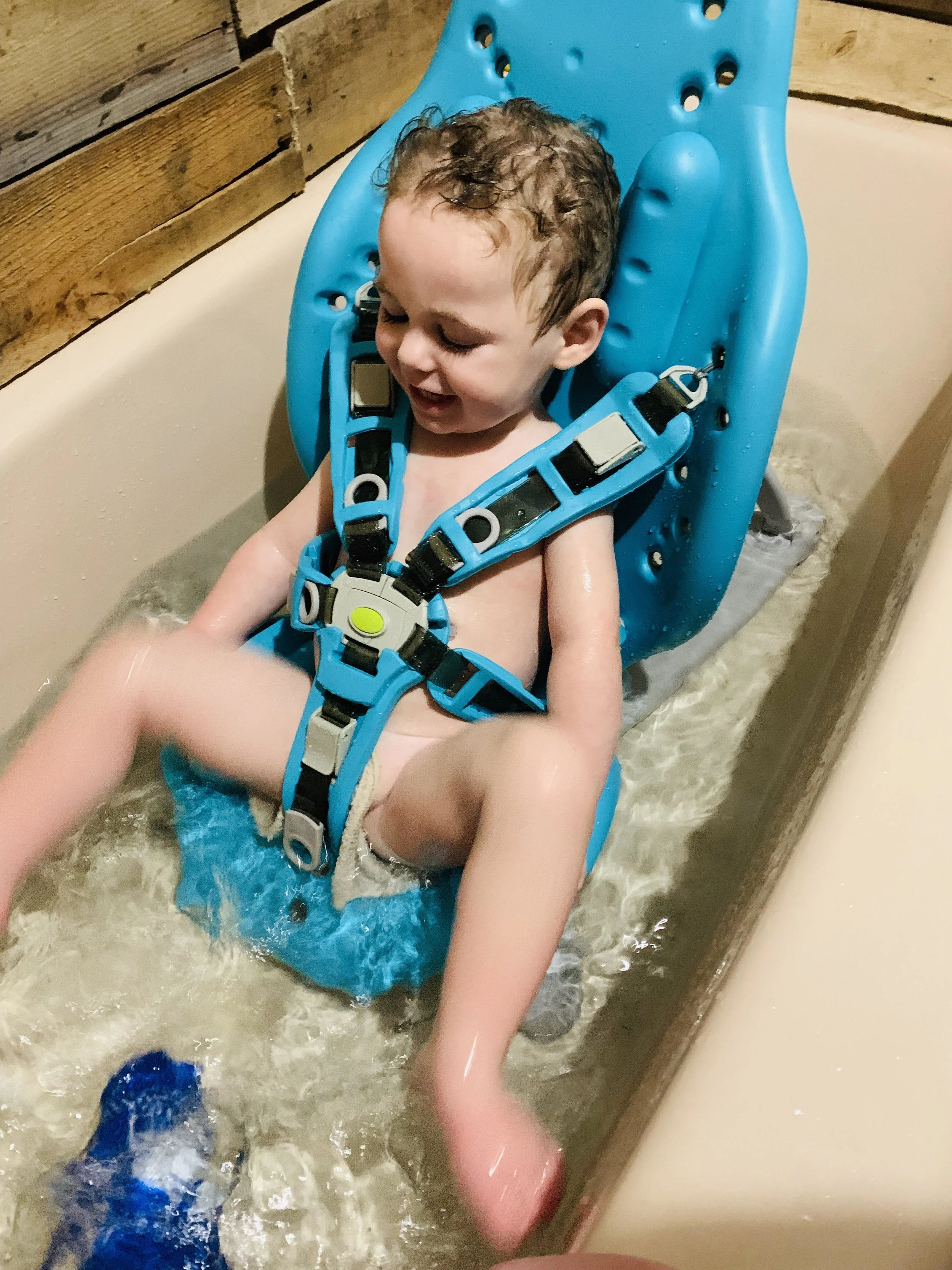 Colton enjoying his new bath chair from Holton’s Heroes at home.