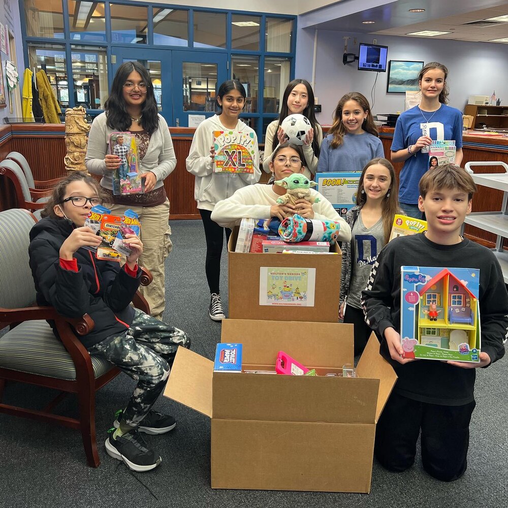 These toys were donated by Demasi Middle school 8th grade red and green halls as well as their 8th grade student council. If this photo of kids helping hospitalized kids have a great holiday doesn&rsquo;t get you going, you might be dead so check you