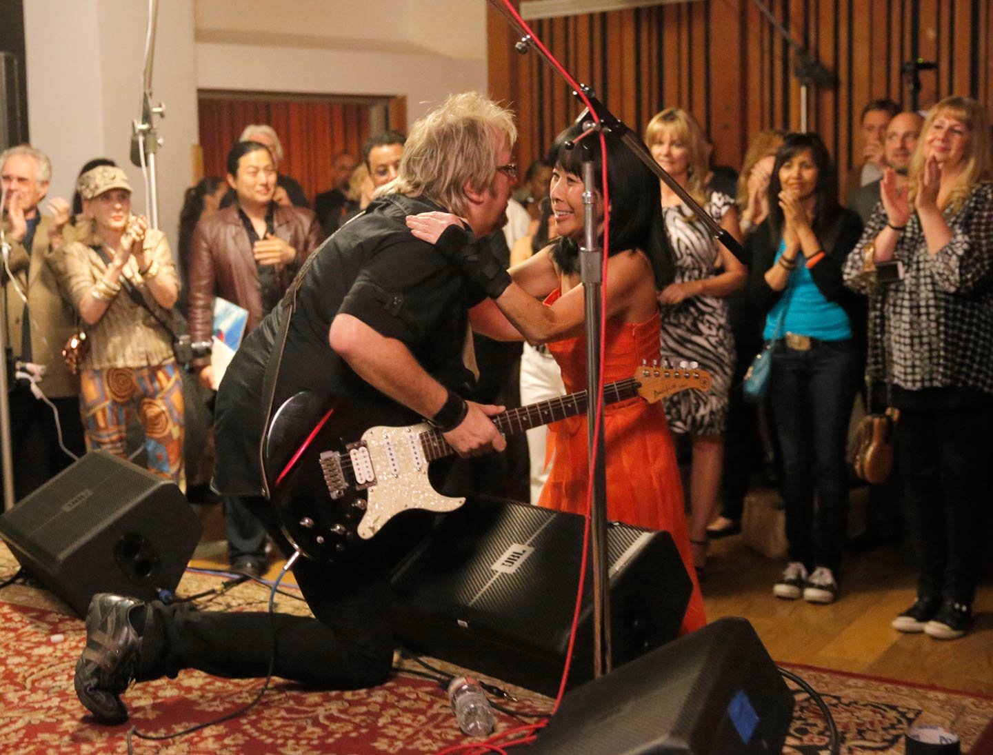 David embraces Jolie Levine as he performs at her benefit concert