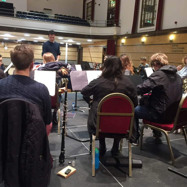 An action shot of our conductor and orchestra in action.