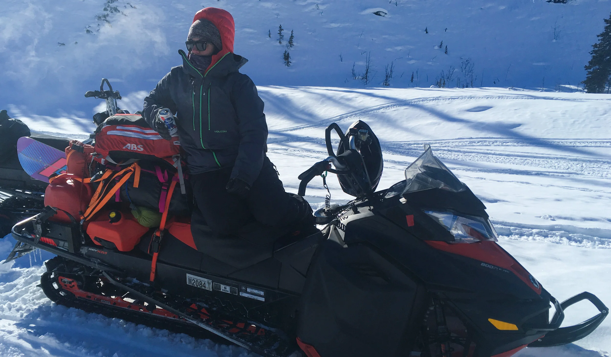Lesley using her over packed sled as a lounge chair.