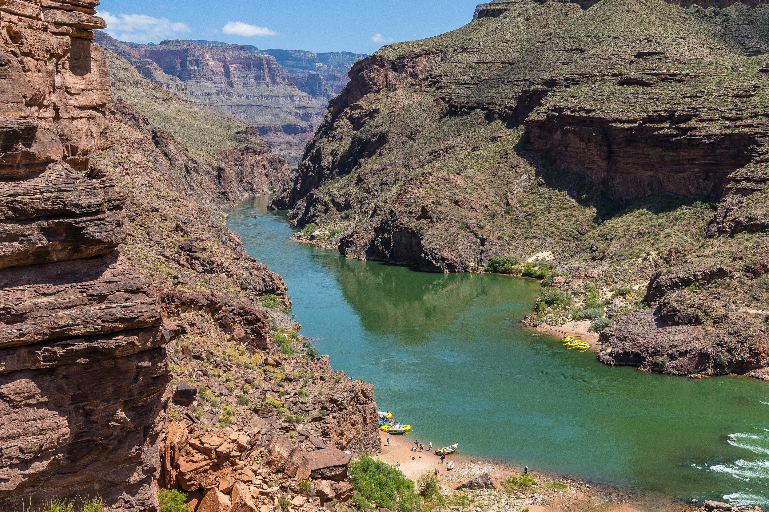 Emerging on to the Colorado River at the end of our second day of hiking. Rafters congregate below. Make friends and they may offer you a cold beer. 