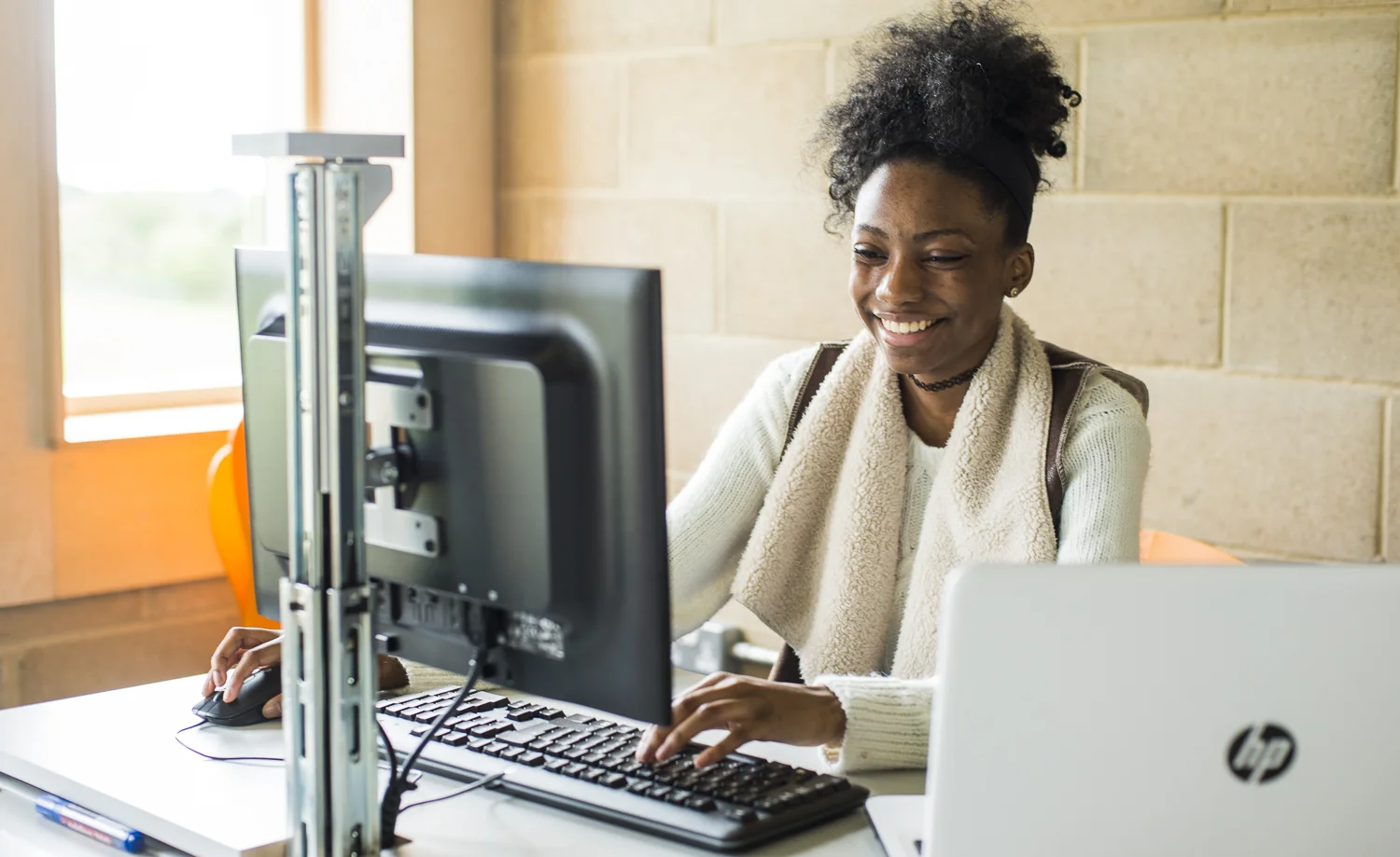 Sixth form student studying at computer