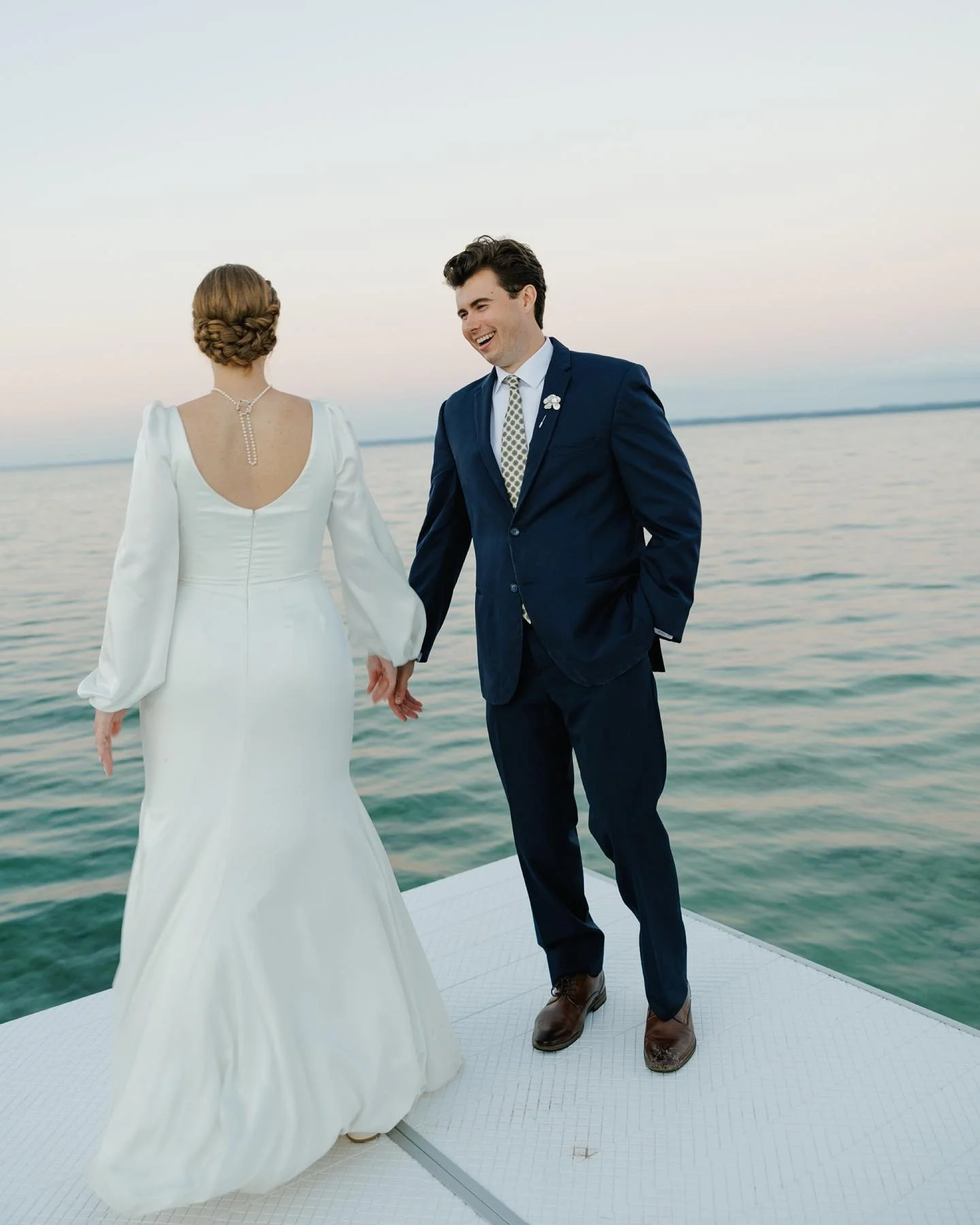 If I could bottle up this wedding day and give it to everyone, I would. It was a day full of presence without an ounce of pretense. Ease surrounded S&amp;S as they celebrated their love at her grandparents&rsquo; home on Old Mission. She wore her mot