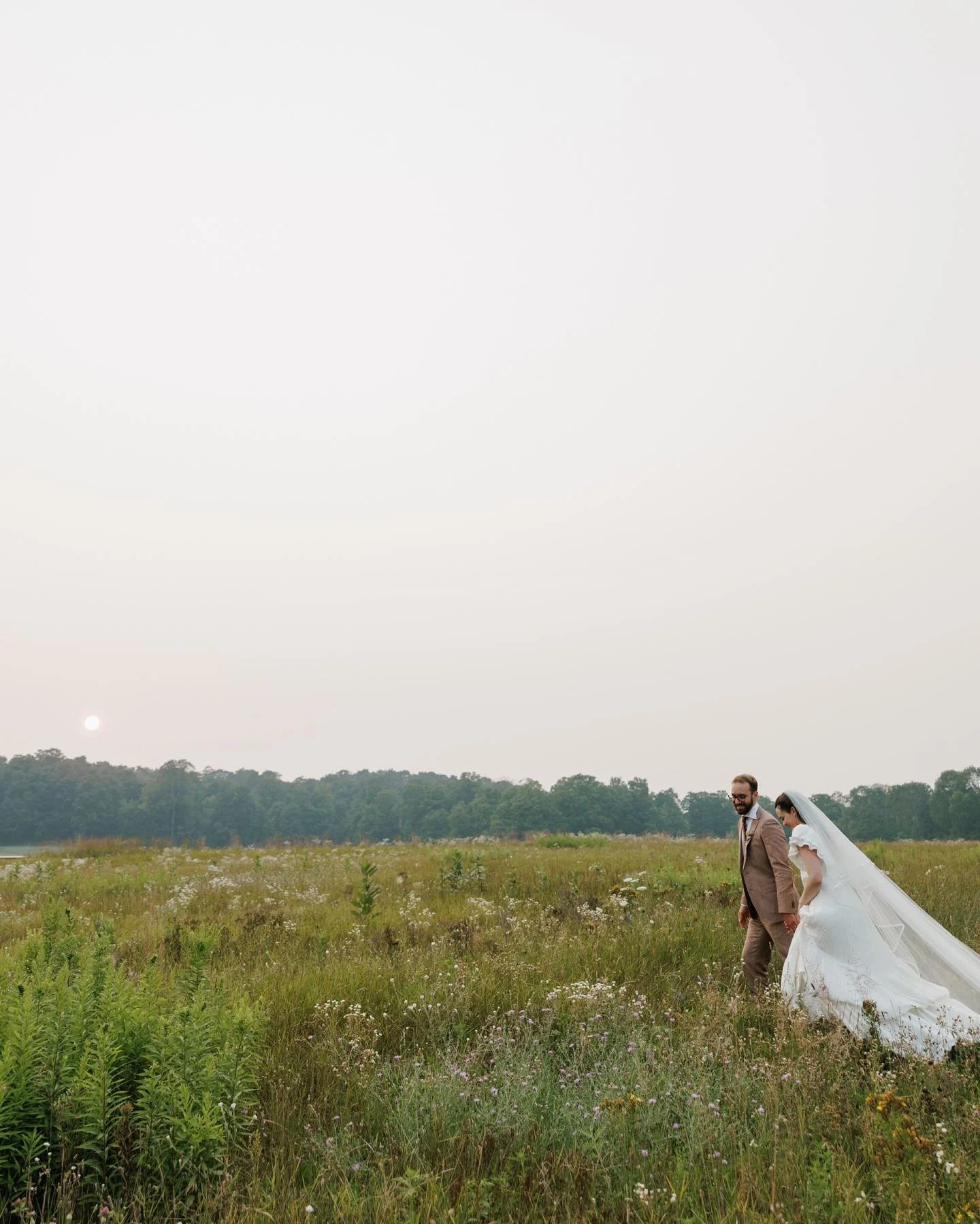 I think a lot about time and place setting when taking photographs, especially on a wedding day. Often when we tell the stories of these monumental days, the season, setting, and weather find their way into the retelling, so including those elements 