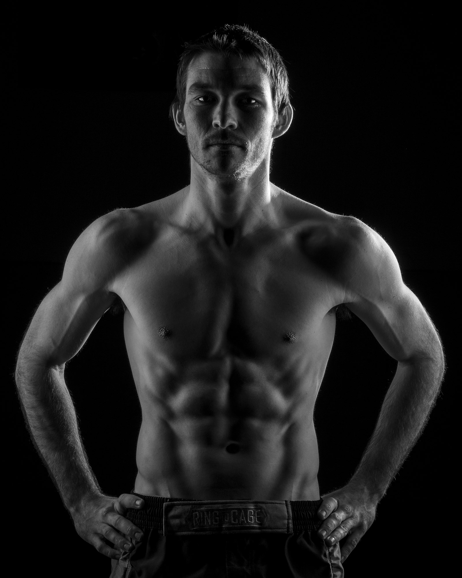 Promo style picture for Jessie, hard side light to accentuate his physique.