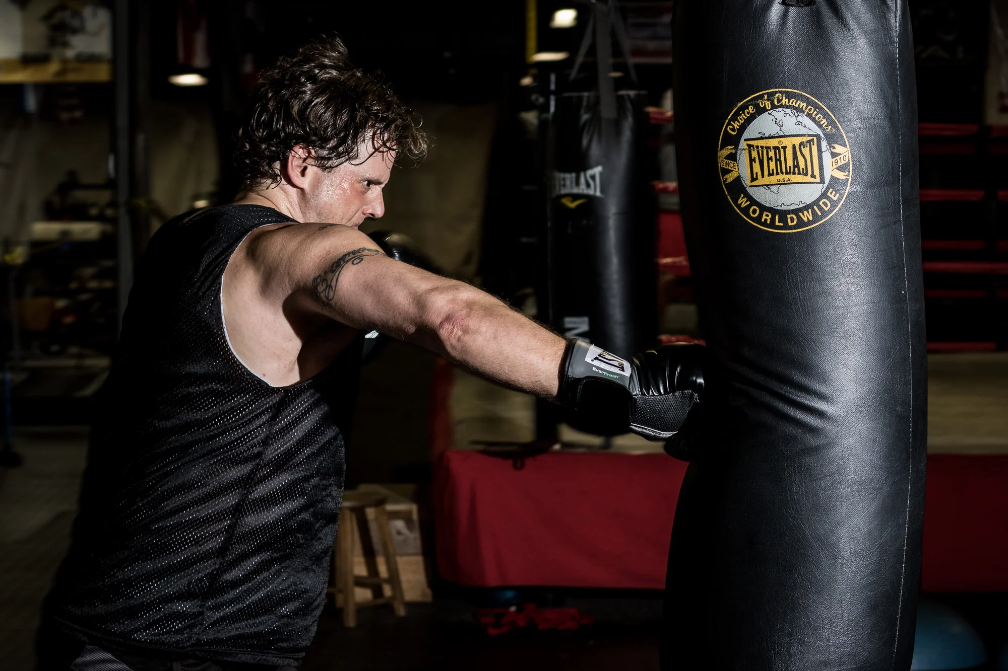 Frank bending the bag with a punch.