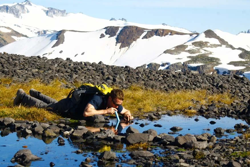 The Lifestraw gives you permission to drink from suspect water sources. It filters 99.8% of the microbes and baddies that can inhabit a water source. Use with the Katadyne desalinator to filter out any bugs as well as the salt.