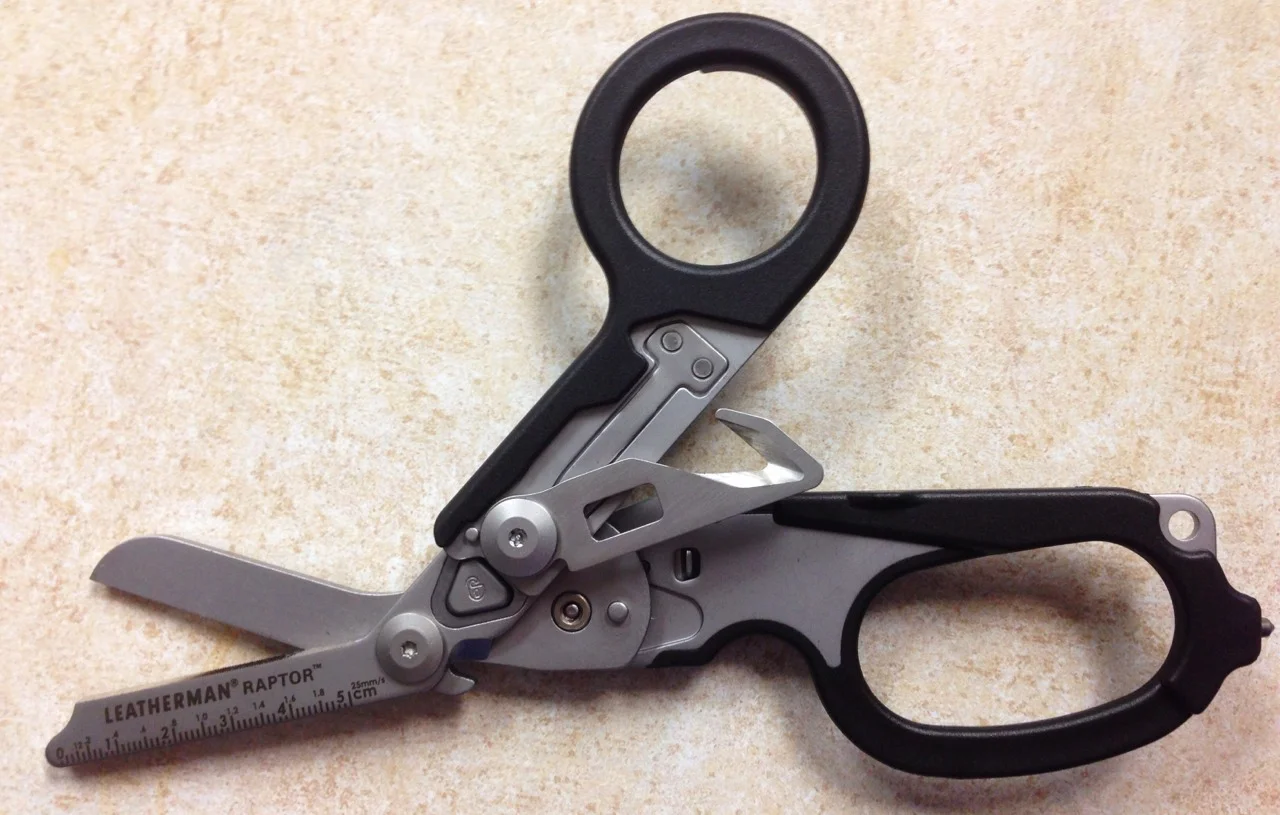 The Raptor Shear from Leatherman will give you quick access to wounds, cutting through fabric, leather, kevlar and rubber. It has a seatbelt cutter, a window punch, an O2 wrench and more. 