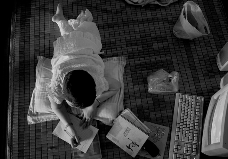 When not at the library, Thao can be found on her wooden day bed writing poetry.