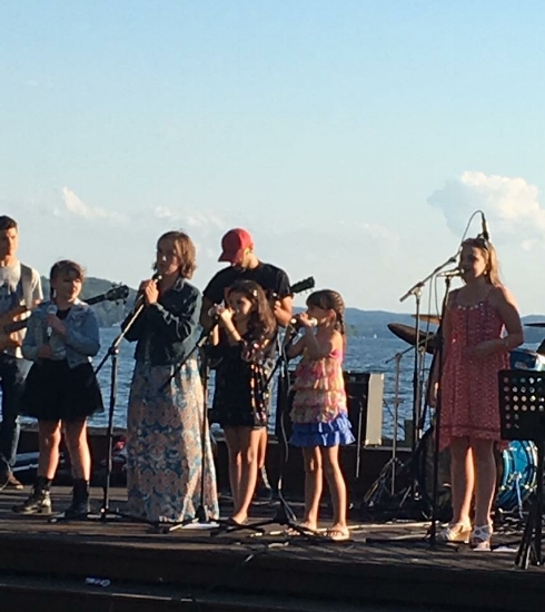 Lena singing with The Glee Girls Ensemble