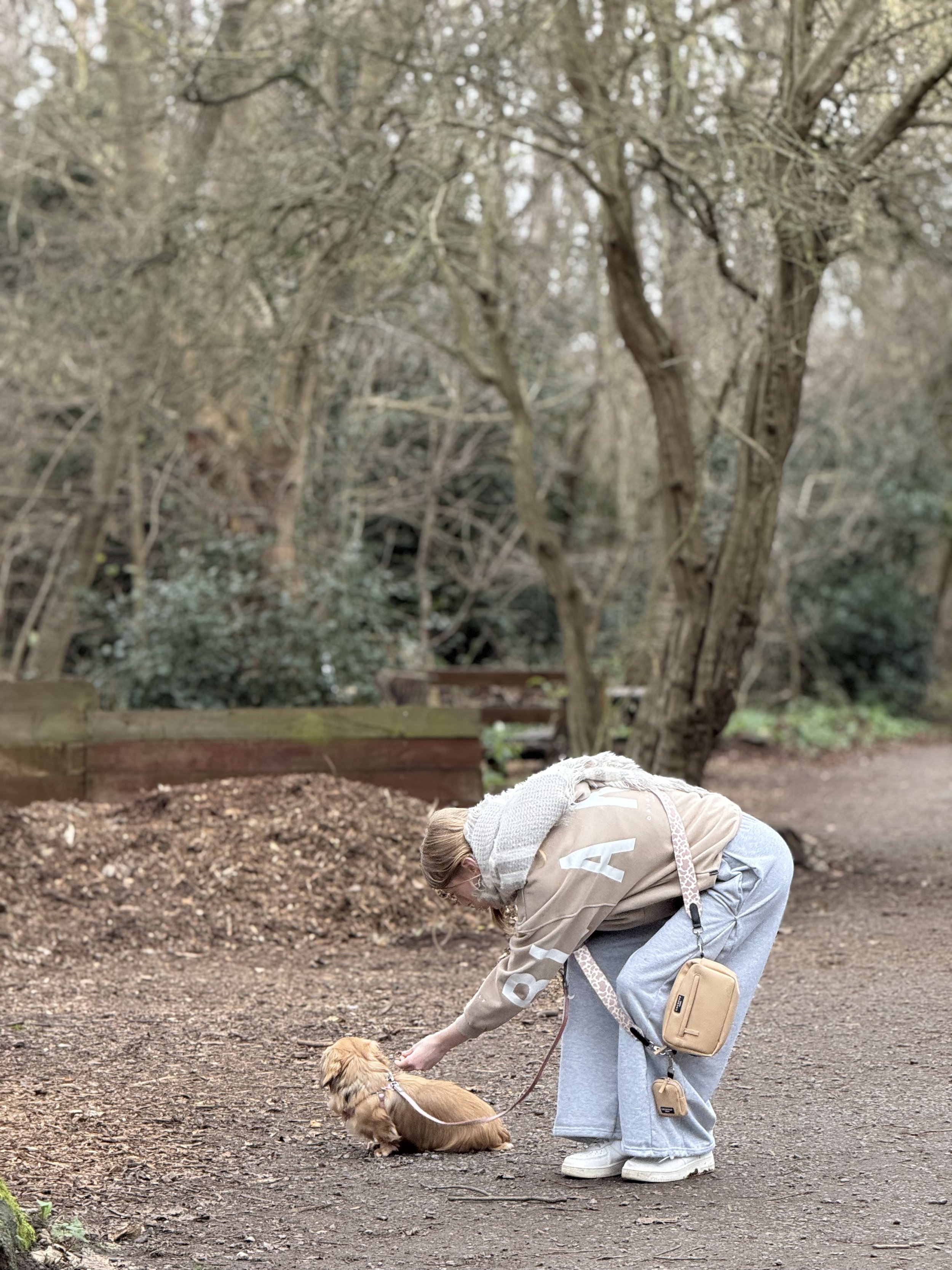 daughter and mini dachshund on walk in woods