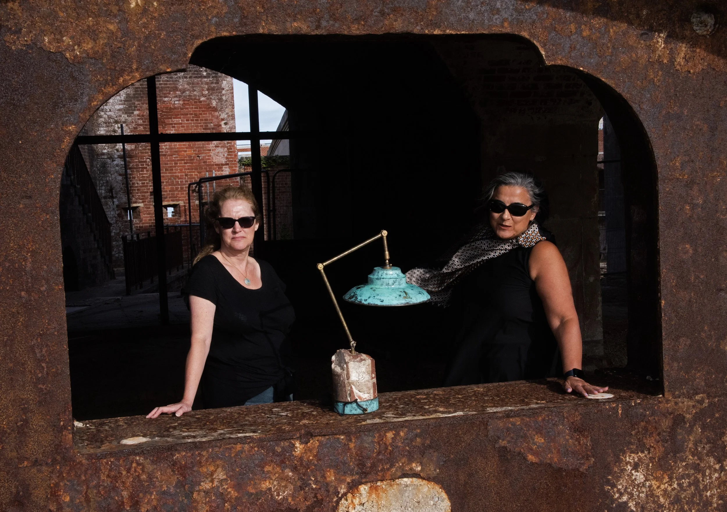 sally and deniz with light at rusty window.jpg