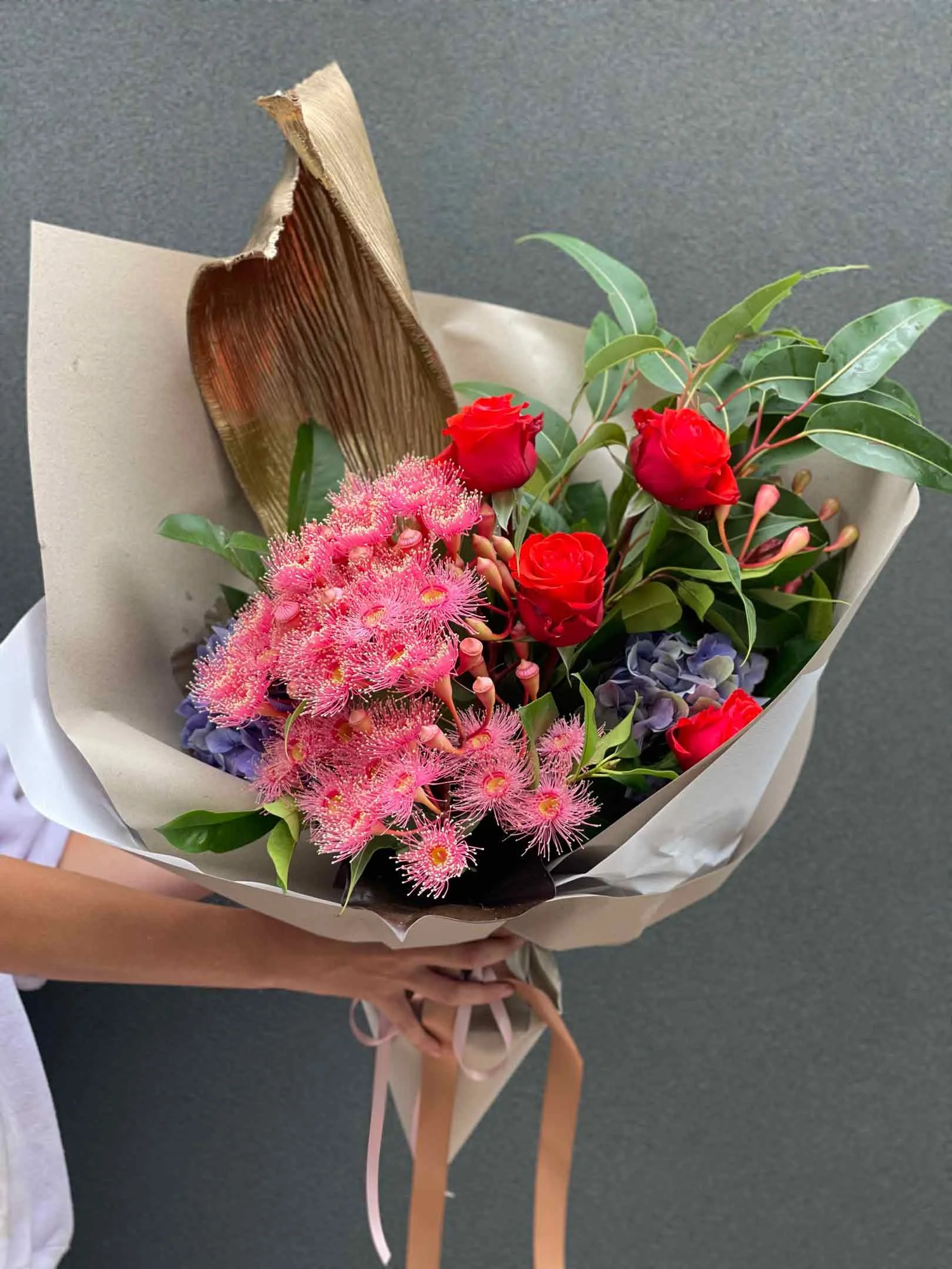 Beautiful red roses with seasonal flowers