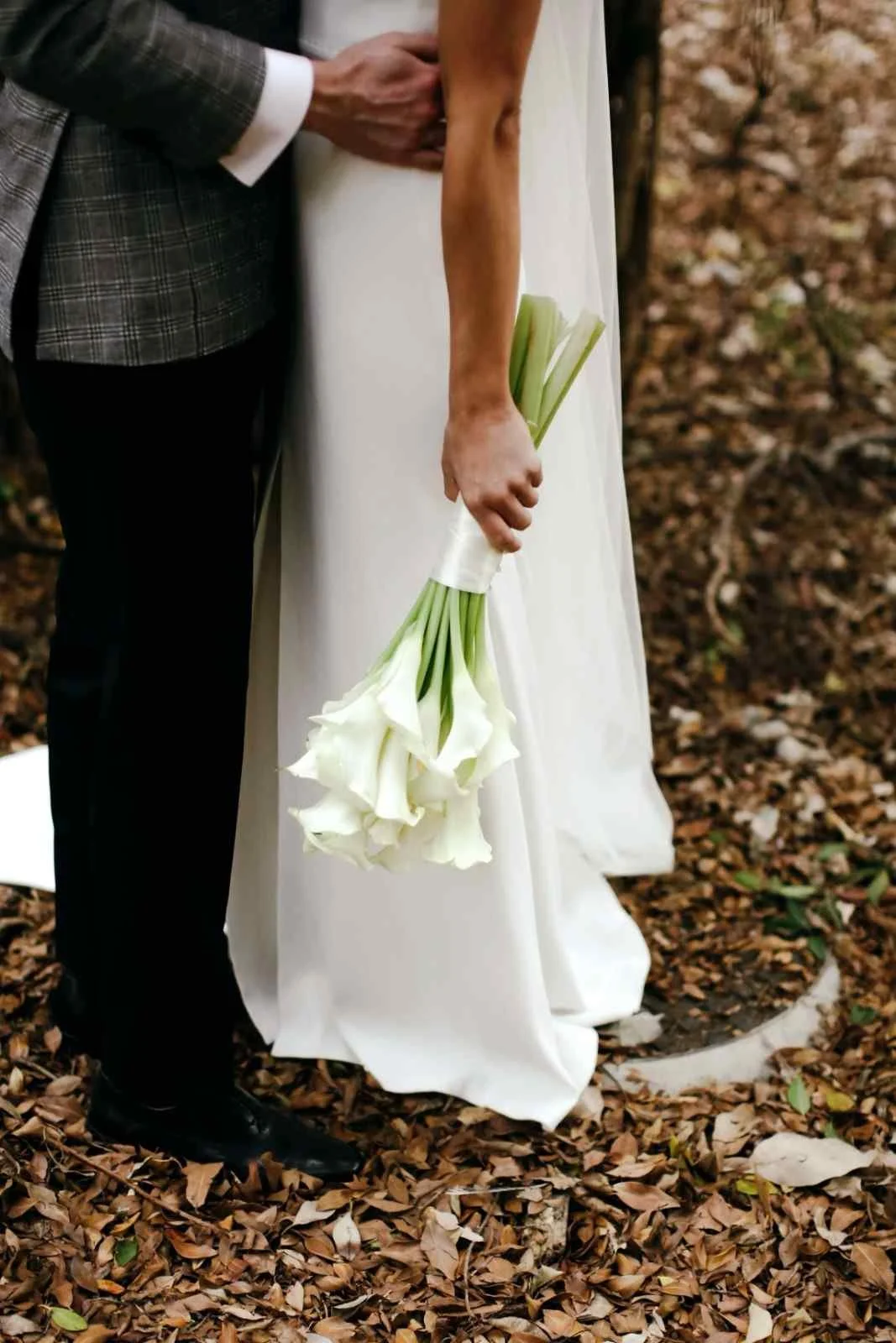 A bride holding a bouquet of white calla lilies in Vaucluse Eastern Suburbs wedding