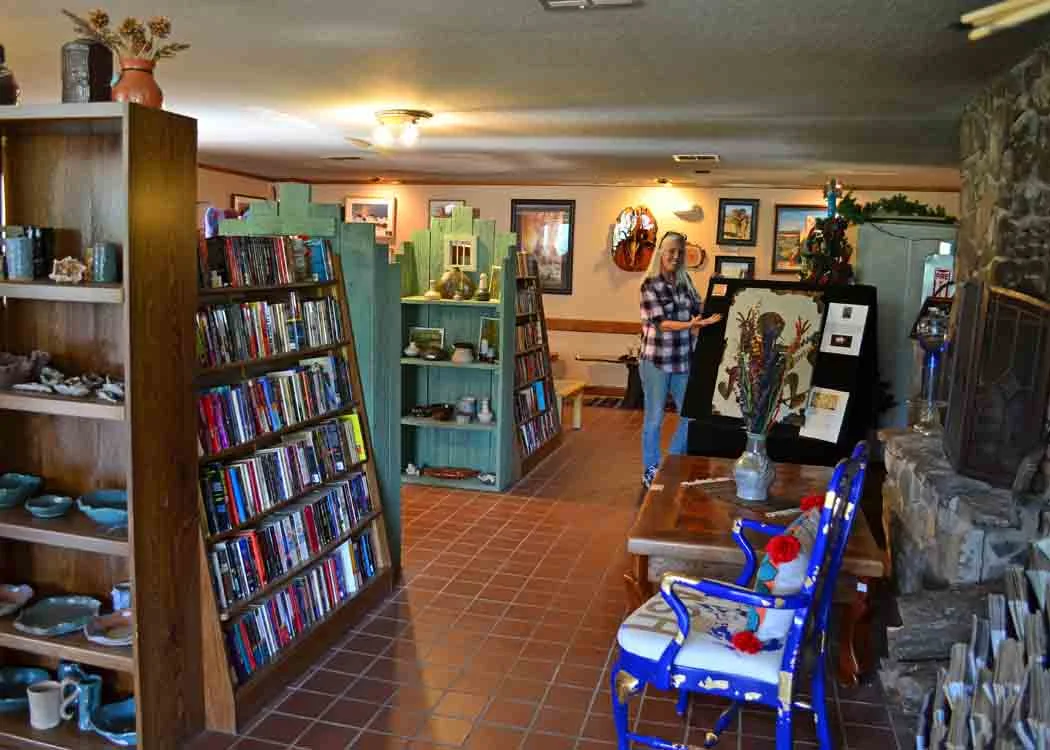 Sue showing her artwork in the bookstore