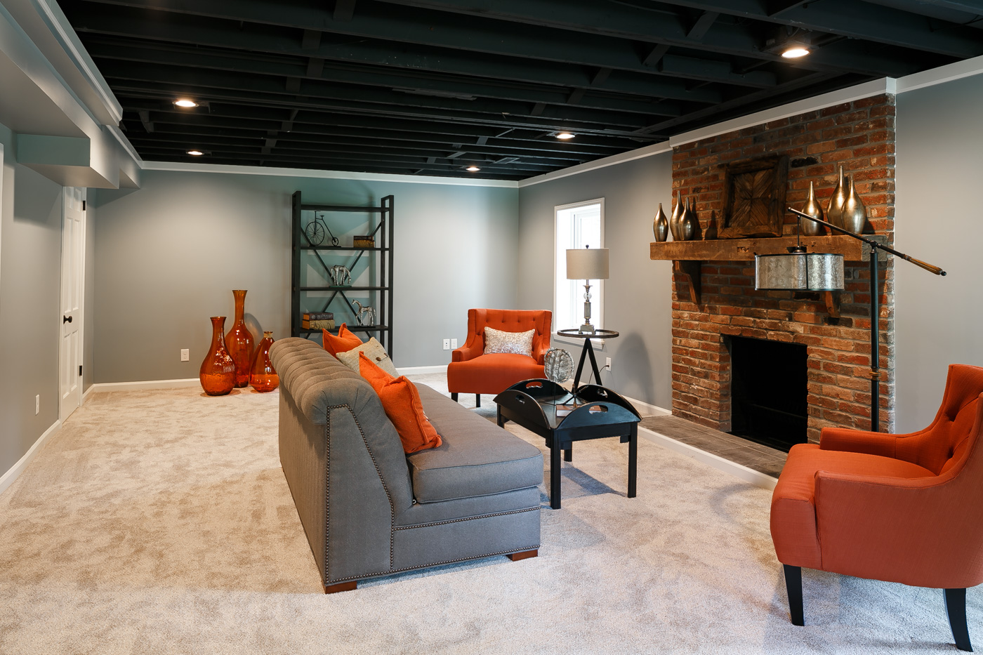 Basement living room with working woodturning fireplace