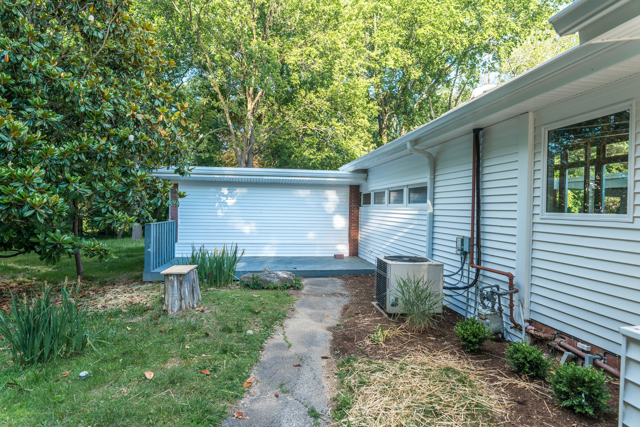 Another patio on the side of the house, by the open yard space