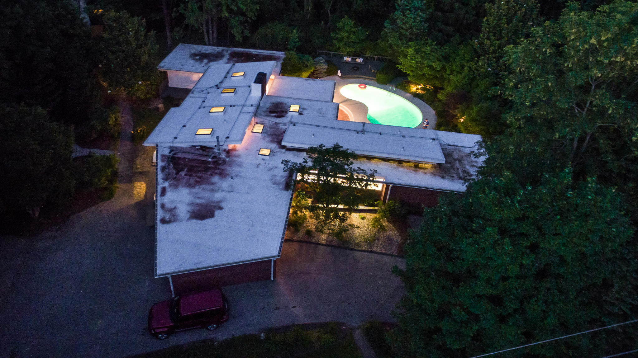 Drone shot of the house/pool area at night