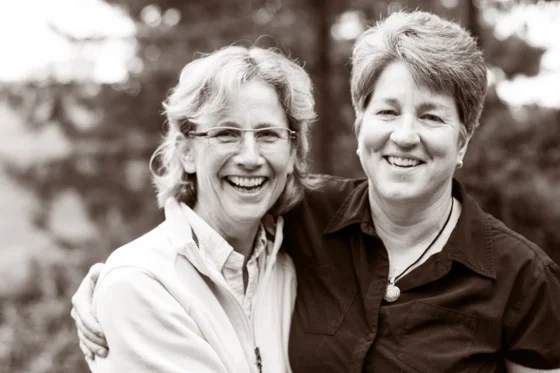 Close up of couple hugging, smiling and laughing.