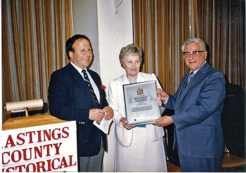 Former mayor of Belleville, George Zegouras, is shown with Nick and Helma Mika during a tribute to the popular local book publishers. Mayor Zegouras often presented Belleville’s VIP visitors with a Mika-published book.