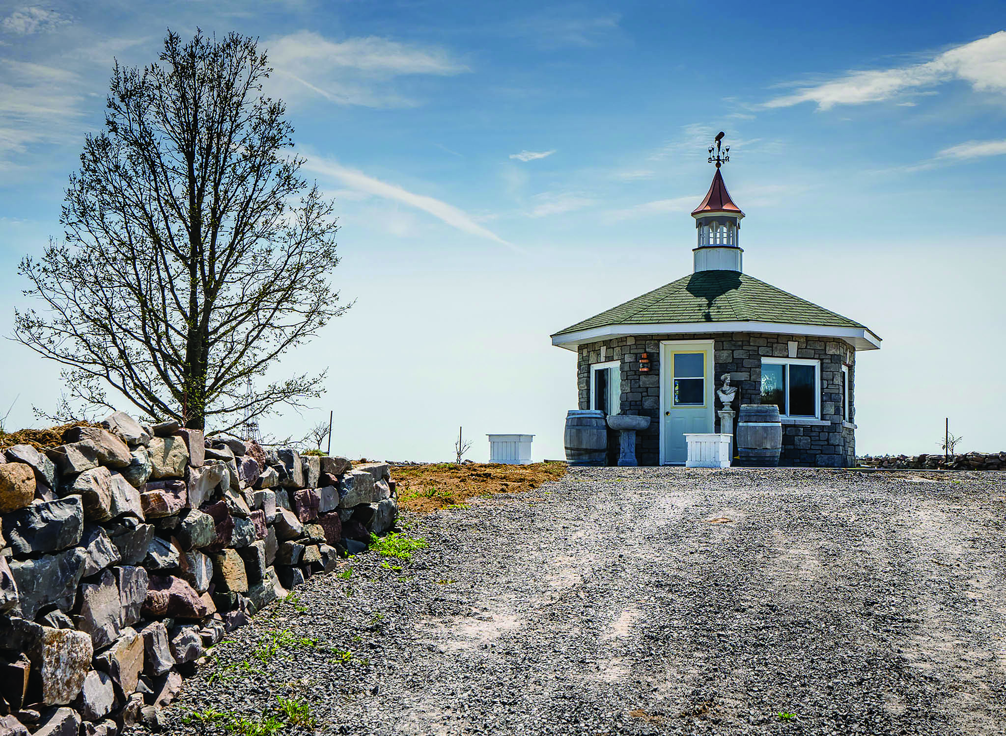 The charming hilltop gazebo at Potter Settlement will remain the temporary wine tasting station until the interior of the large custom winery building at the base of the hill is complete. Johnson says an arbour will be built around the gazebo, complete with hanging grape vines.. Photo by Gail Burstyn