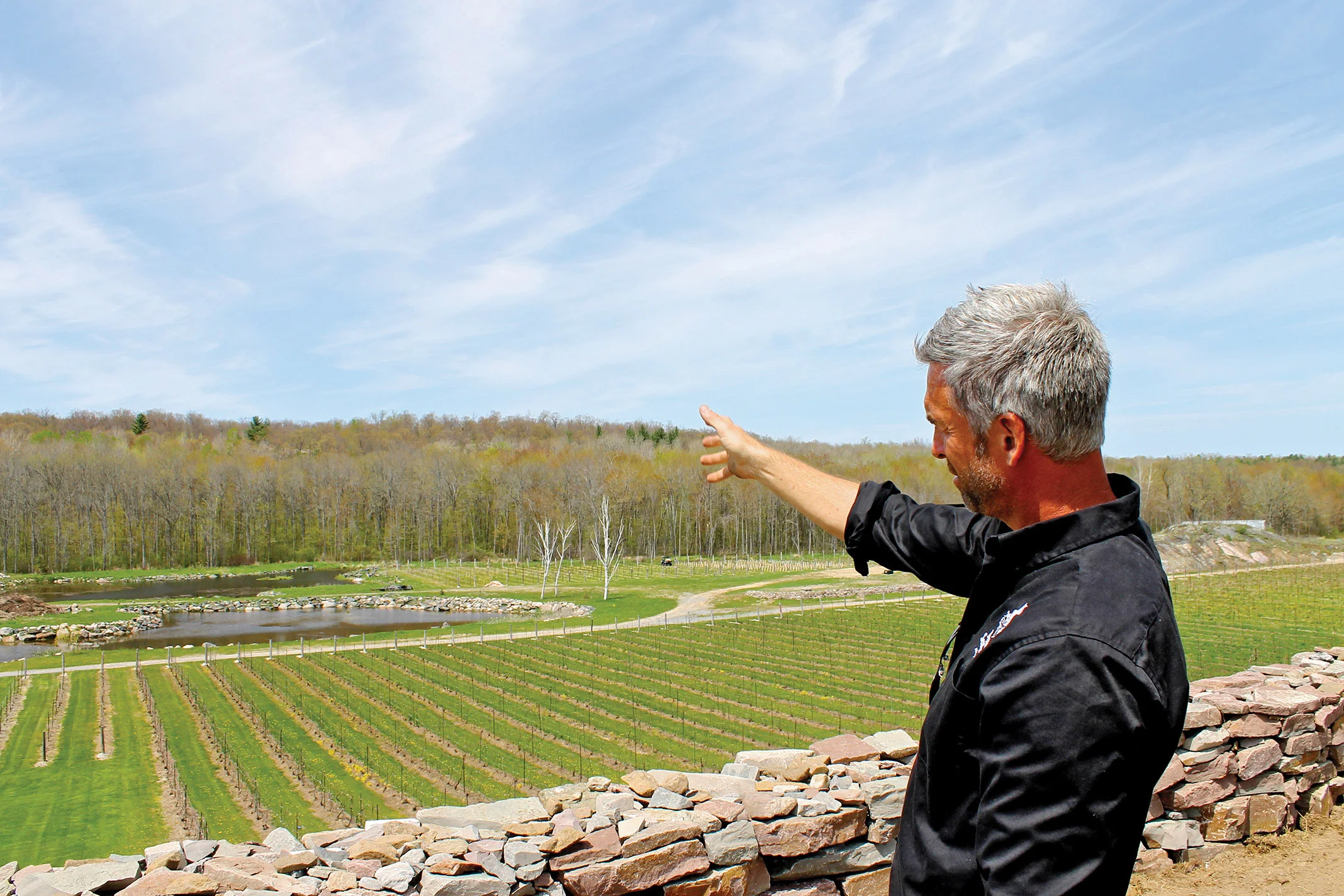 Big dreams just get bigger: Johnson describes future plans for Hasting's first winery, including more construction, landscaping, and hosting weddings and special events. Photo by Michelle Annette Tremblay