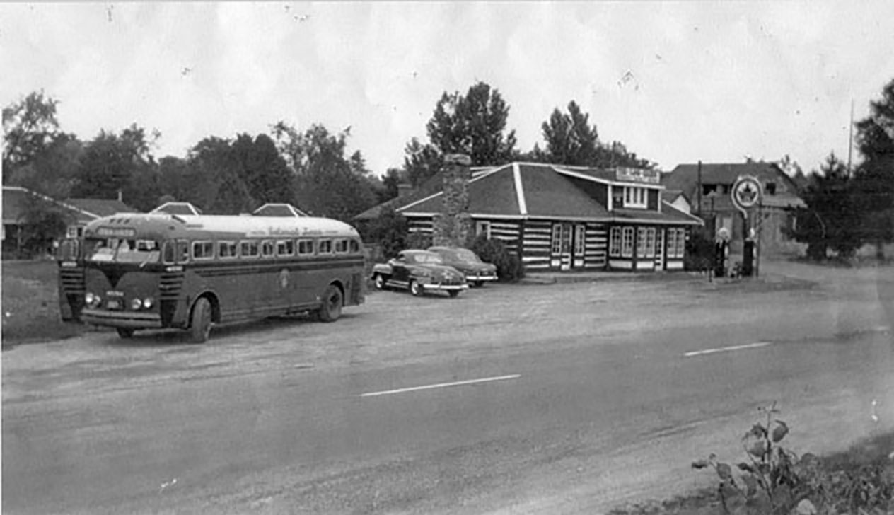 The Log Cabin was a busy spot at the time this photo was taken around 1950. With Highway 7 established as a major route connecting Toronto and Ottawa, cars and buses would often pull in for food and gas. Photo courtesy Tweed Heritage Centre/Tweed News