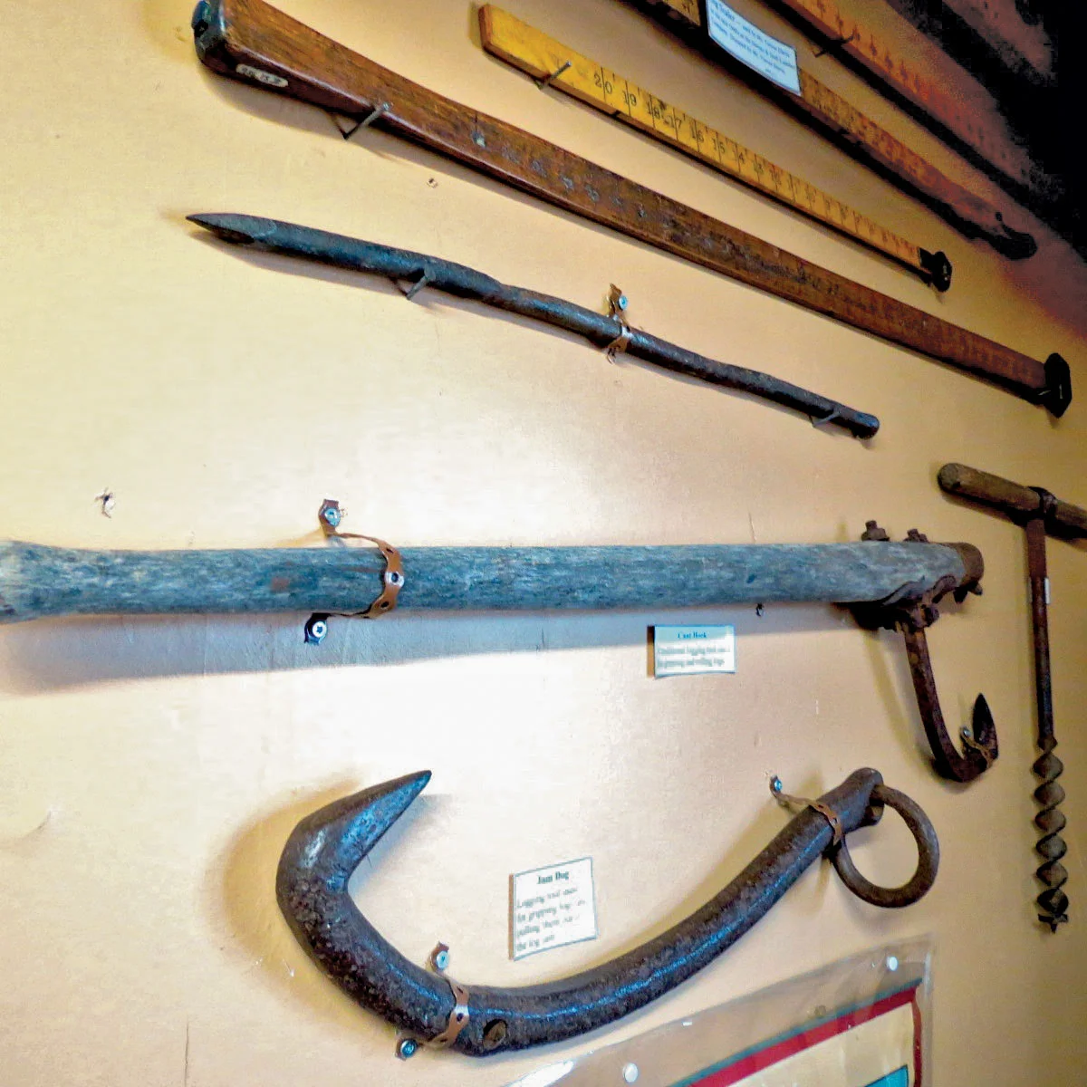 Adzes, tools for shaping logs, and star log stamping hammers, were used by Rathburn Lumber Co., during log drives in the early 1900’s. Stamping peens allowed each company to stamp its logs and camps with the most would get a bonus. Photo by Sarah Vance