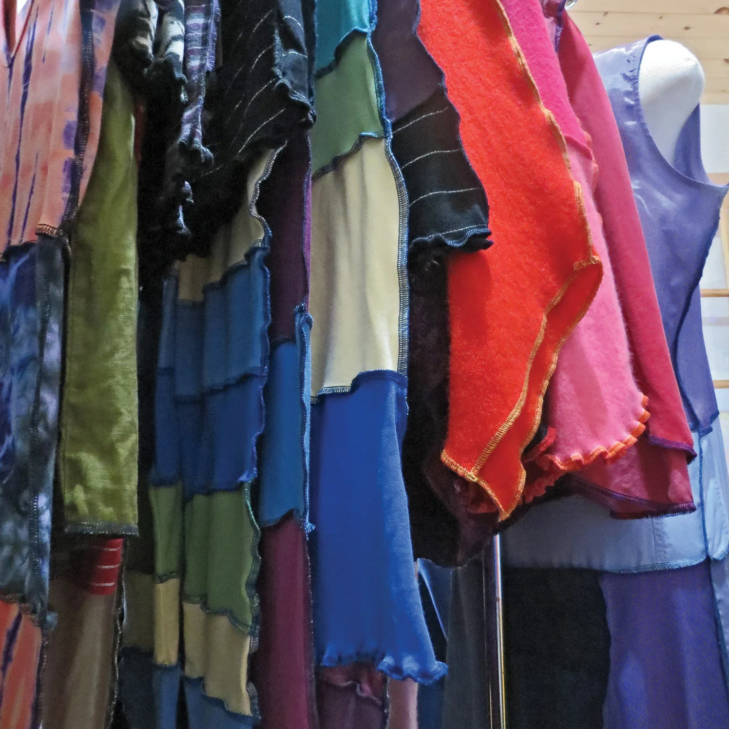 While many clothing designers will try to hide seams, Lucky Maloo’s designs draw attention to contrasting fabrics and flaunt exposed seams. Photo by Sarah Vance