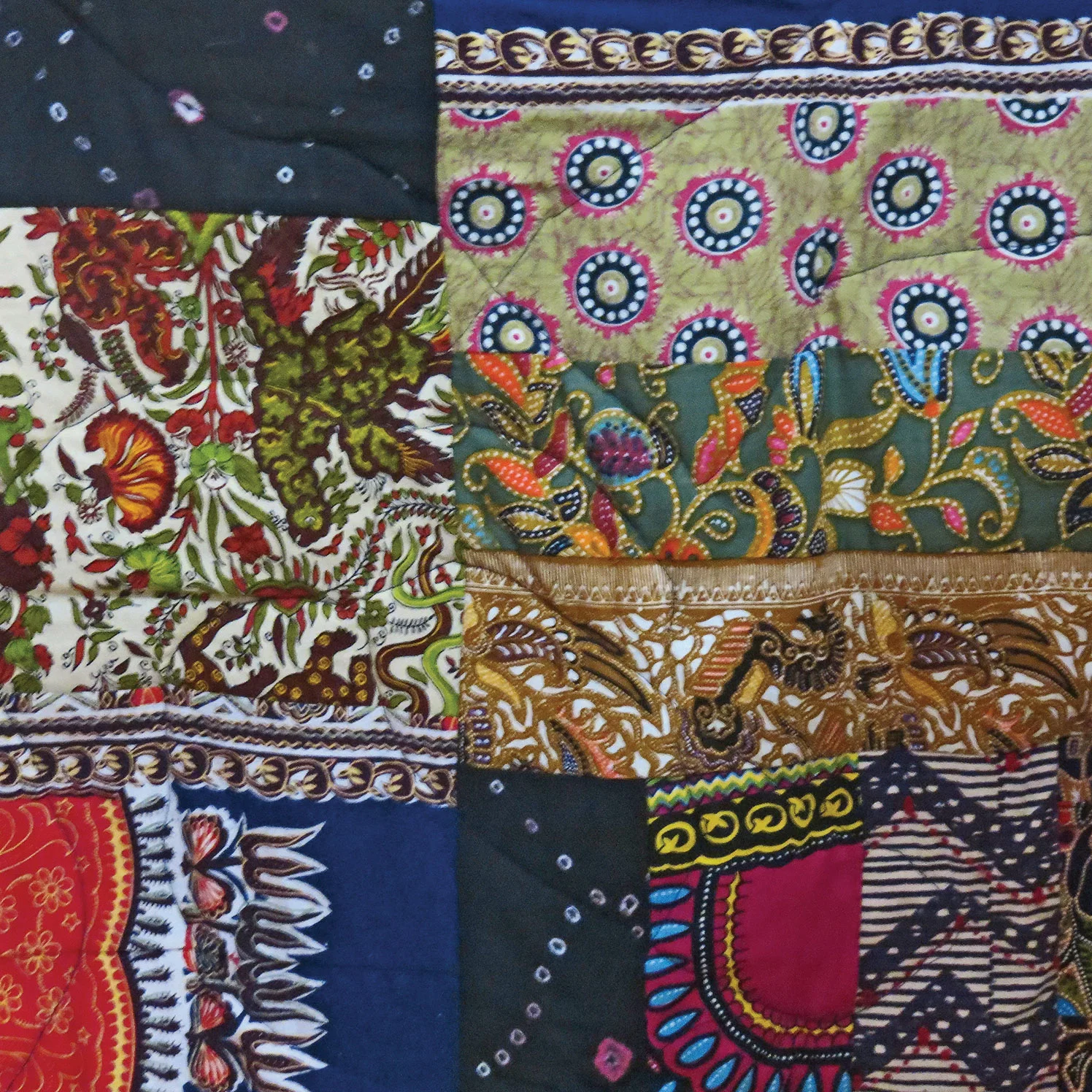 Lucky Maloo designs quilts, often commission pieces, that often involve repurposing a clients clothing to create a family heirloom.