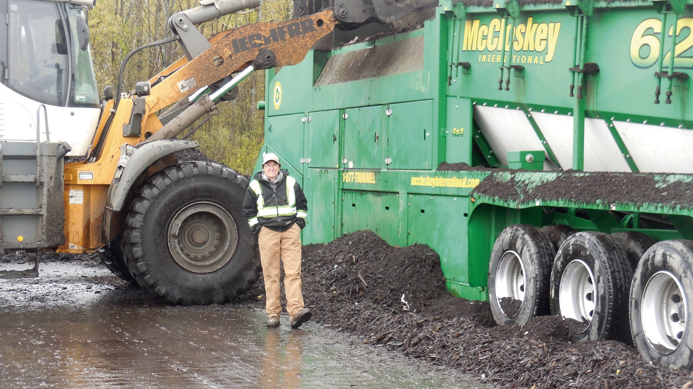 Al Hamilton’s sister Liz is one of a half dozen or so Astoria crew who run a front end loader to move the material around and ‘fluff it up’ when needed. She’s not only a staff member, but a customer as well.