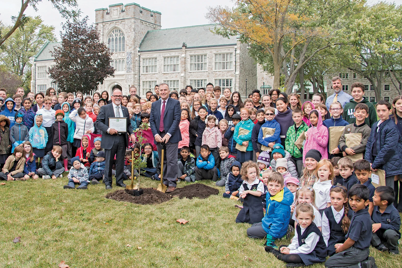 Albert College is rooted in Canadian history; now more than ever. An oak tree species native of Vimy Ridge — sight of one of the Canadian Forces’ defining battles — was planted on the grounds of the Belleville independent school on October 13. Bay of Quinte MP Neil Ellis (right) and Albert College Head of School Keith Stansfield, with students behind them, show the Vimy Oak tree planted at the school. Photo courtesy Albert College
