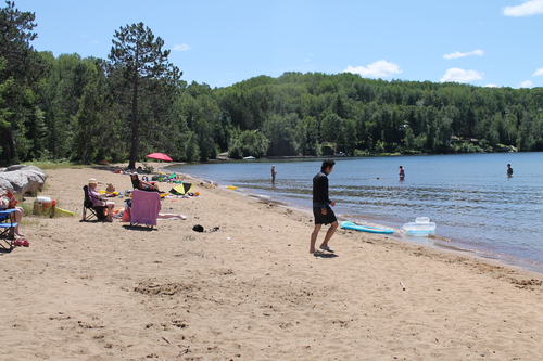 The public beach at Papineau Lake is a favourite for kids and adults alike.