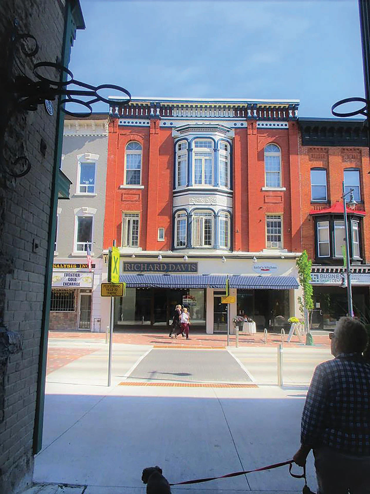 Pedestrians strolling along the Belleville Footbridge walk out to an example of a beautiful historical renovation that combines modern retail spaces with residential units. Photo by Shelley Wildgen.