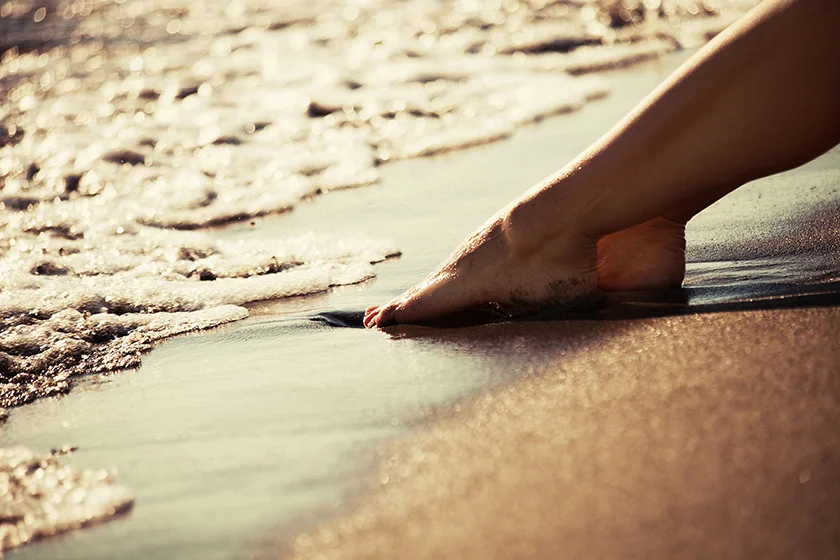 WEB woman feet beach low res.jpg